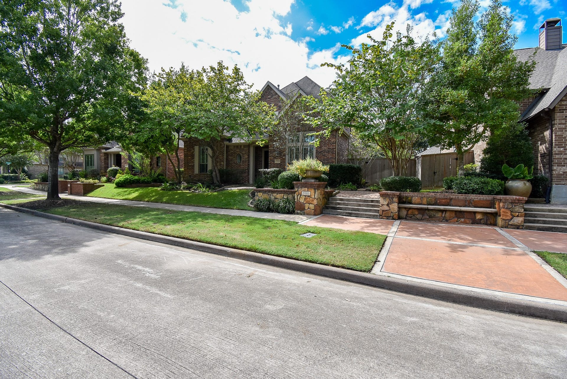 Awesome curb appeal tucked inside beautiful trees and mature landscaping.