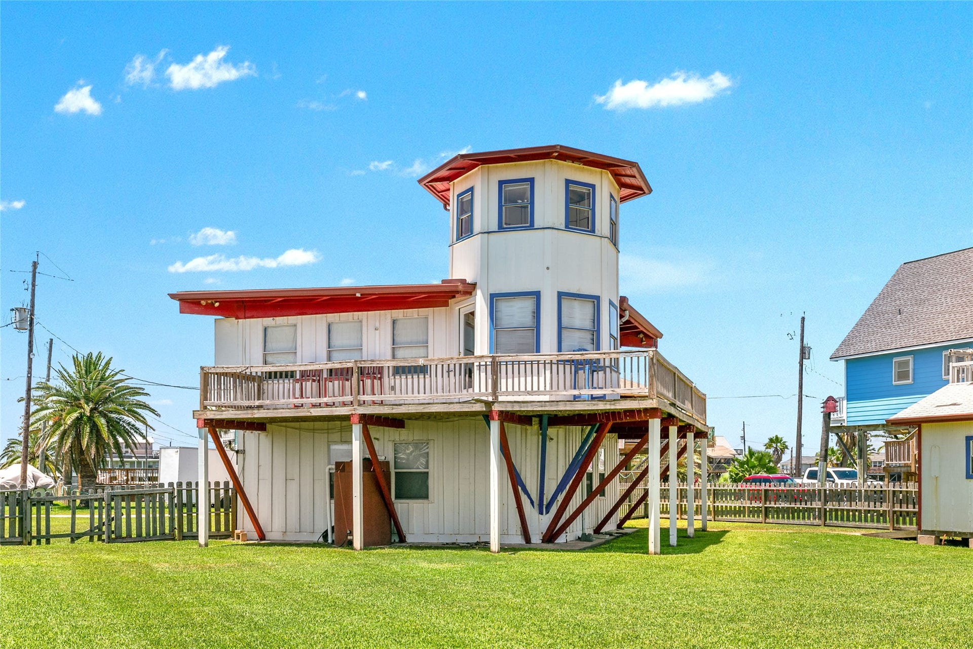 1319 Middle Street, Surfside Beach, TX 77541 A fun, lighthouse-inspired home with beautiful water views! Whether you're looking for an Airbnb, weekend getaway, or full-time residence, this unique property offers plenty of possibilities. The large fenced yard includes a storage shed that's perfect for beach gear or even a golf cart.
