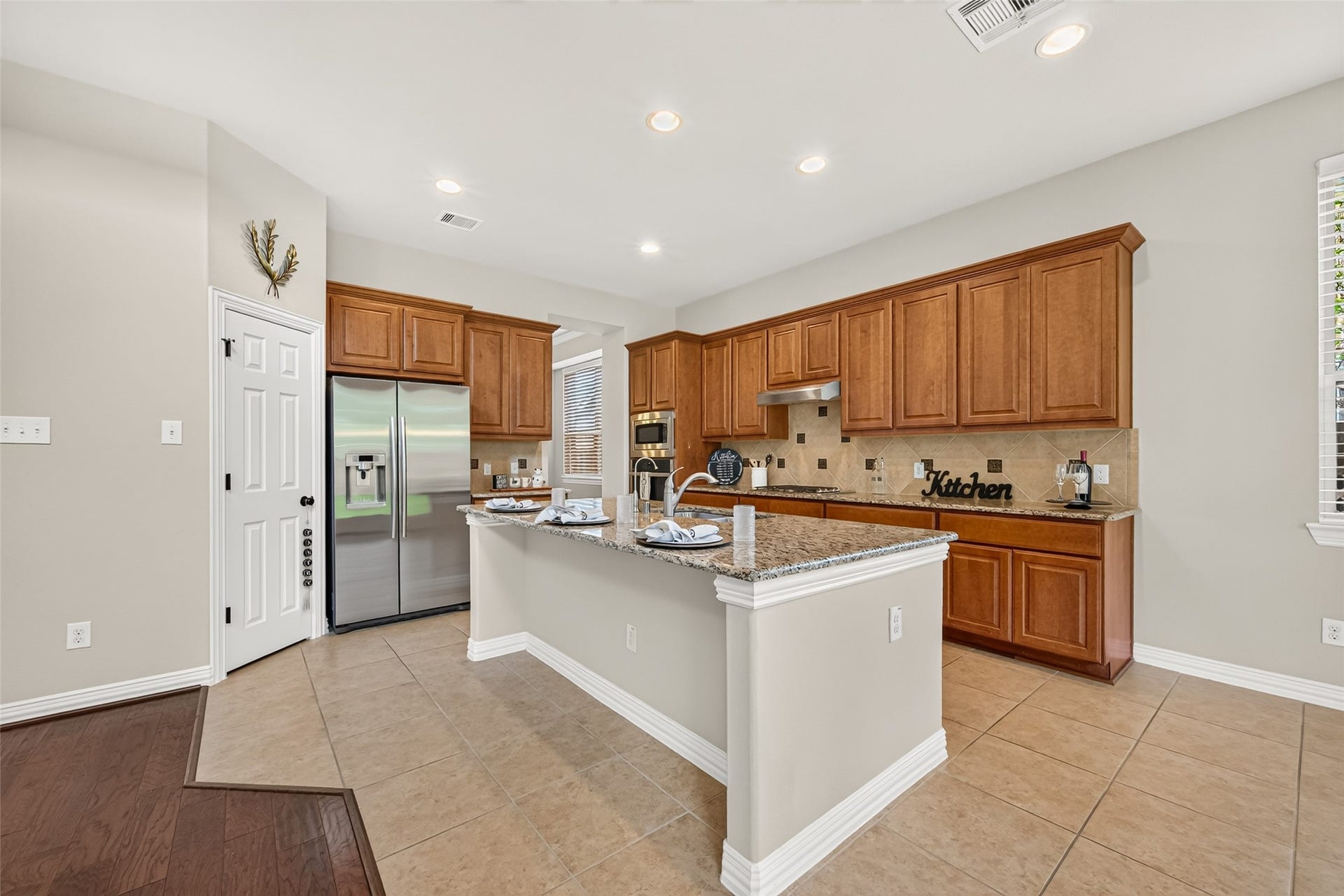Granite kitchen island with view to the family room