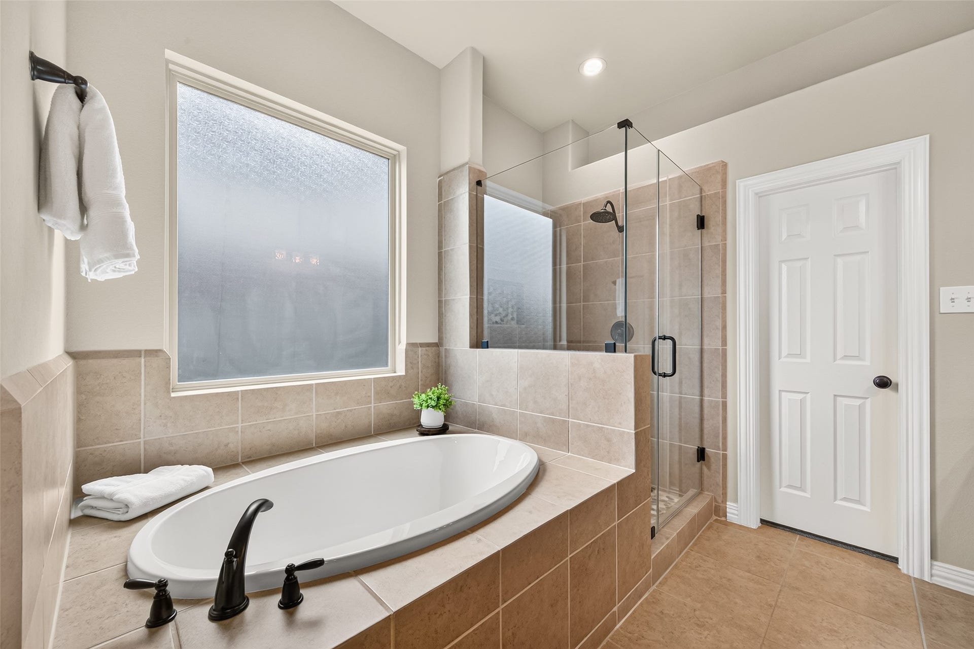 Unwind in the updated primary bathroom soaking tub