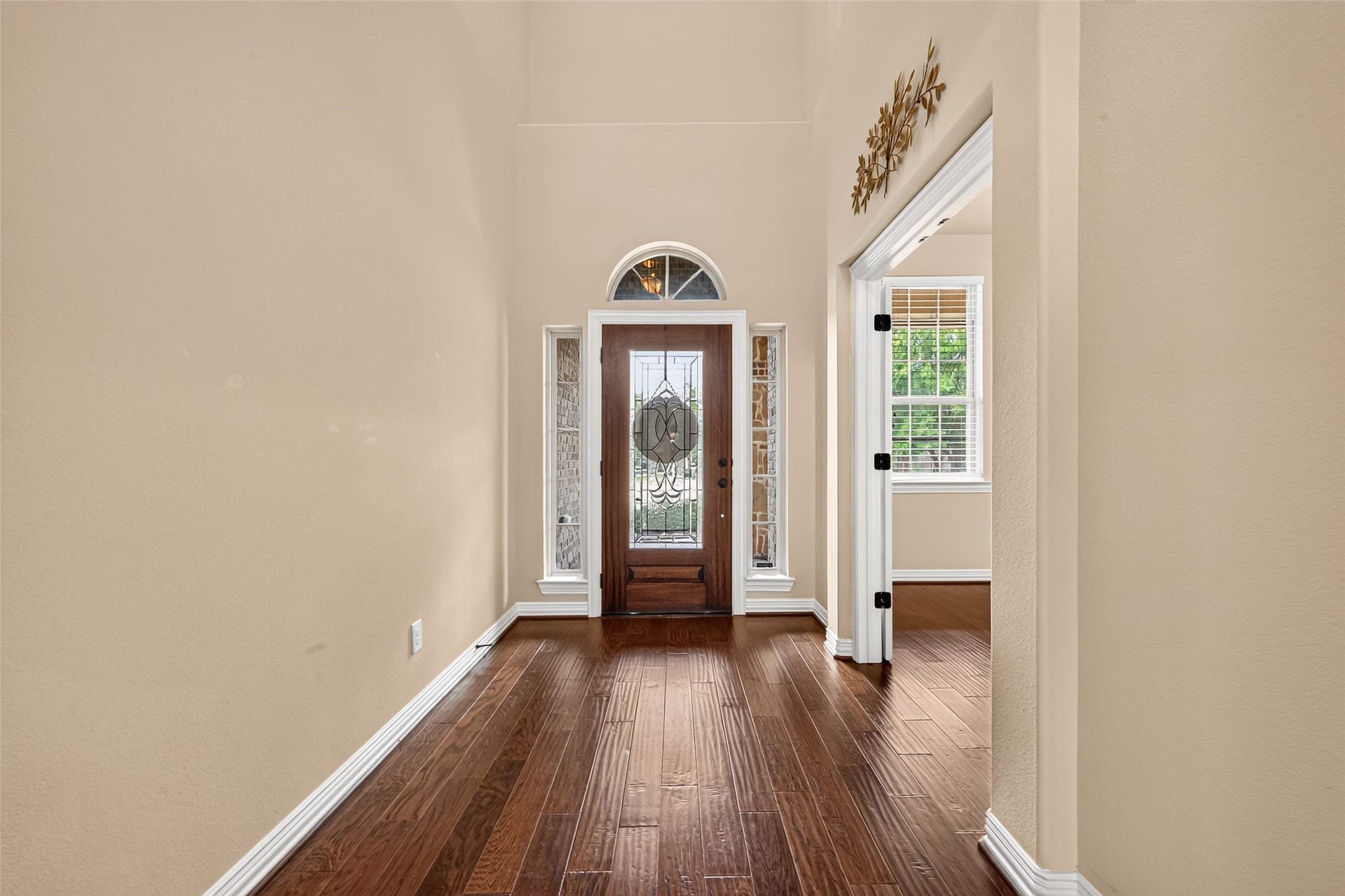 Step inside the foyer: engineered wood floors, hallway to the staircase