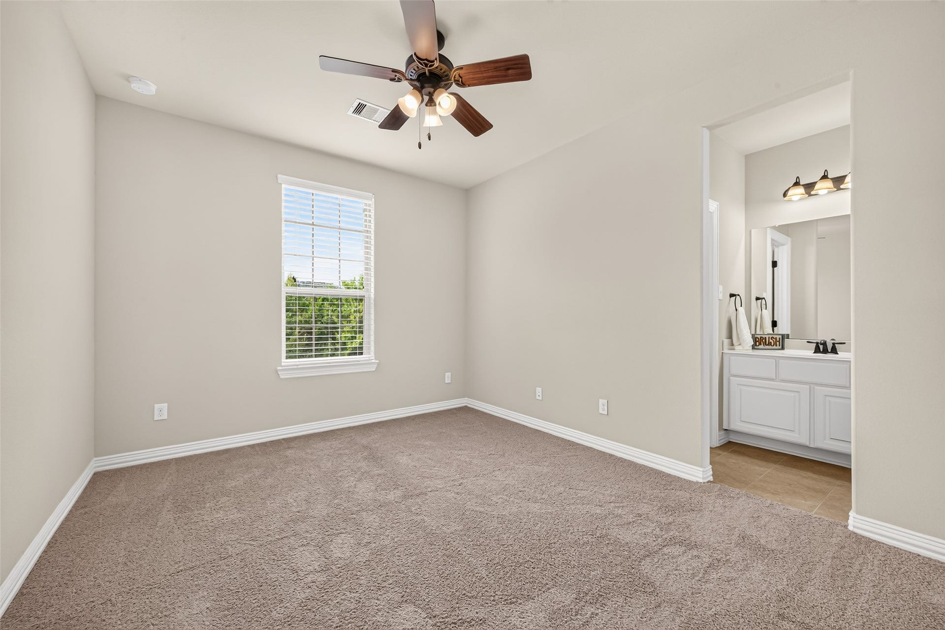 Bedroom with window and bathroom access