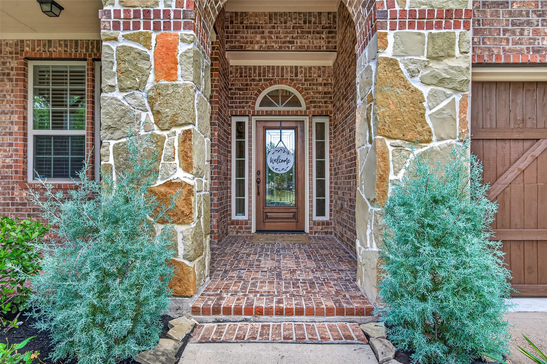 Covered front porch leading to the entry door