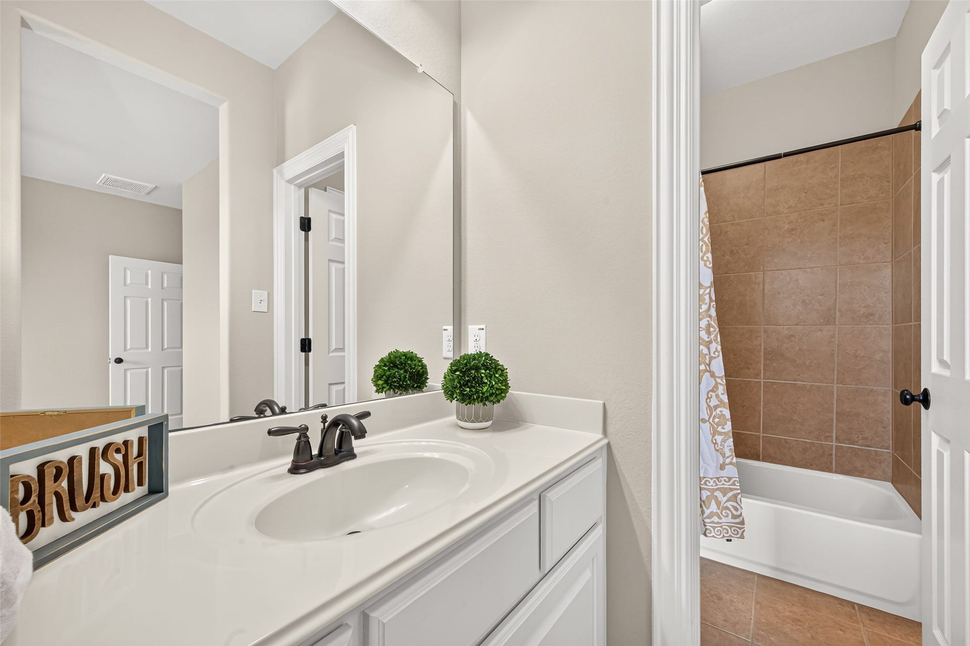 Secondary bathroom vanity and tub