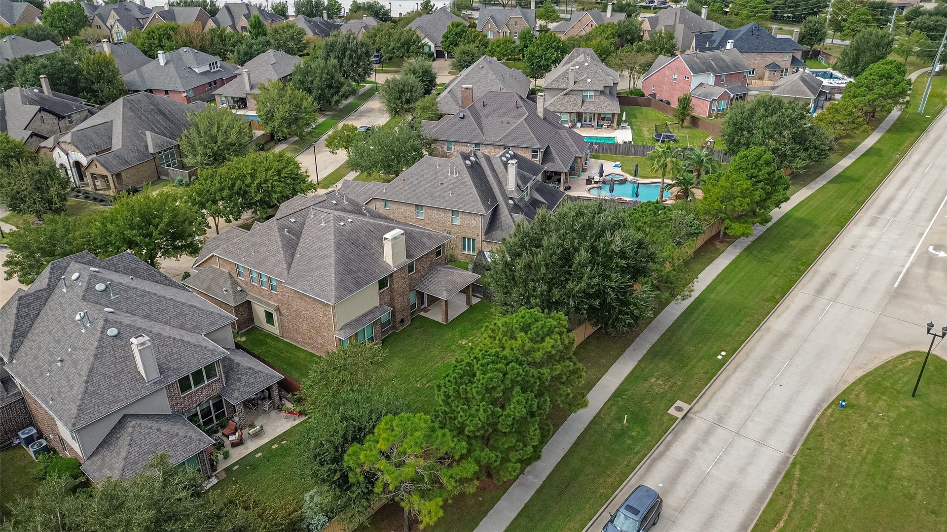 Aerial view of the home and nearby street