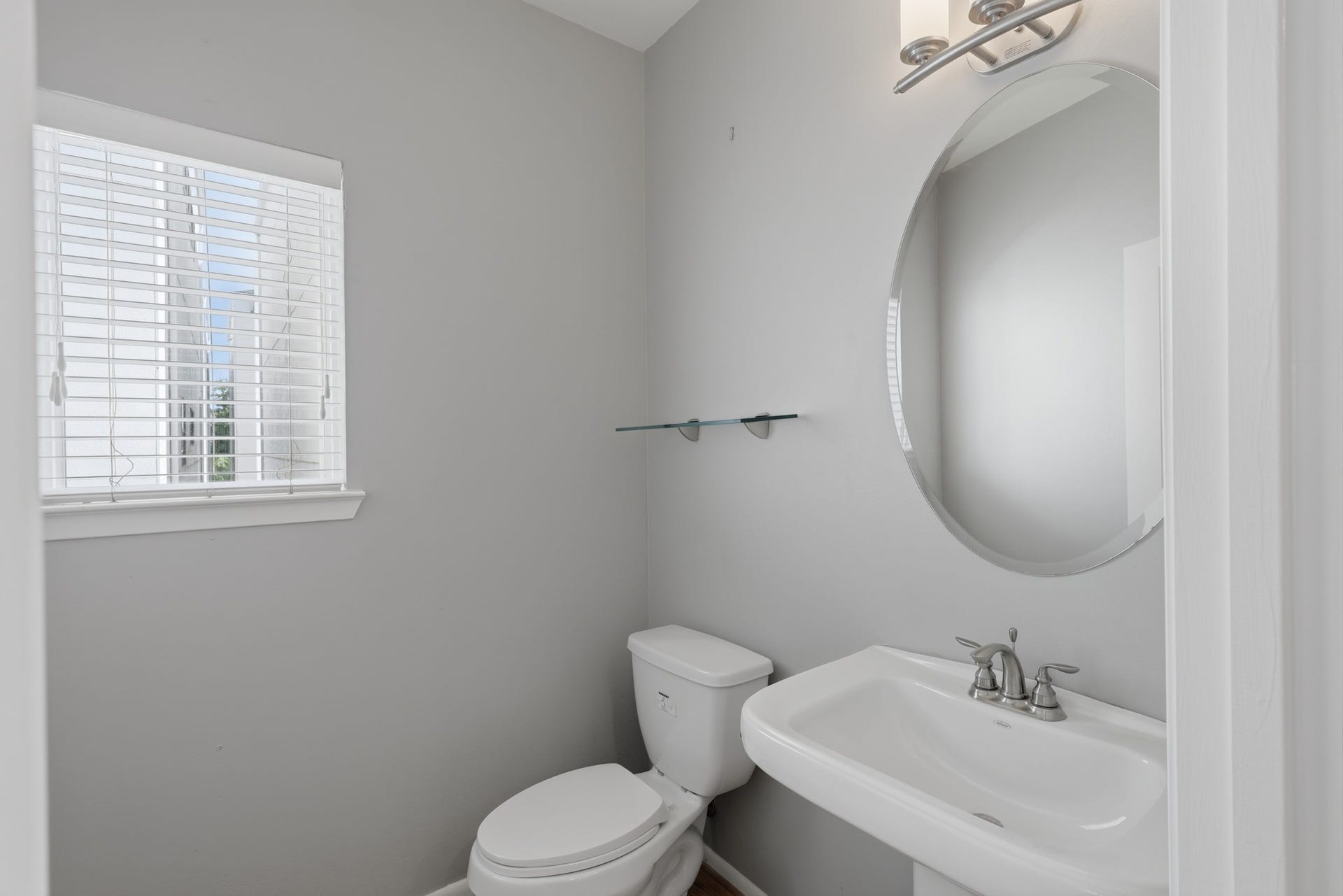 Conveniently located powder room in the main living area, providing an easily accessible bathroom for guests without entering the private bedroom spaces.