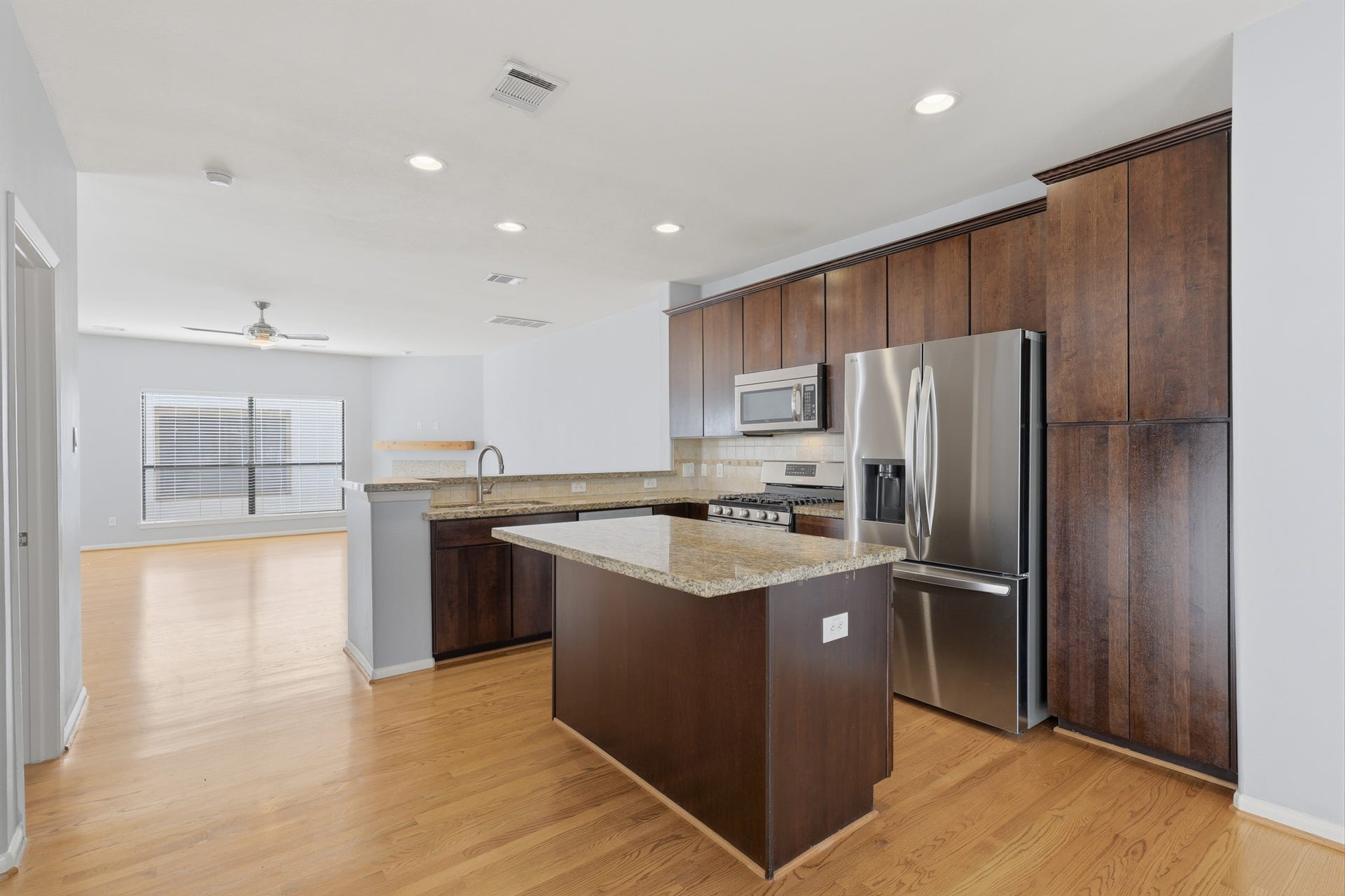 The open layout creates a natural connection between the kitchen, living and dining spaces.