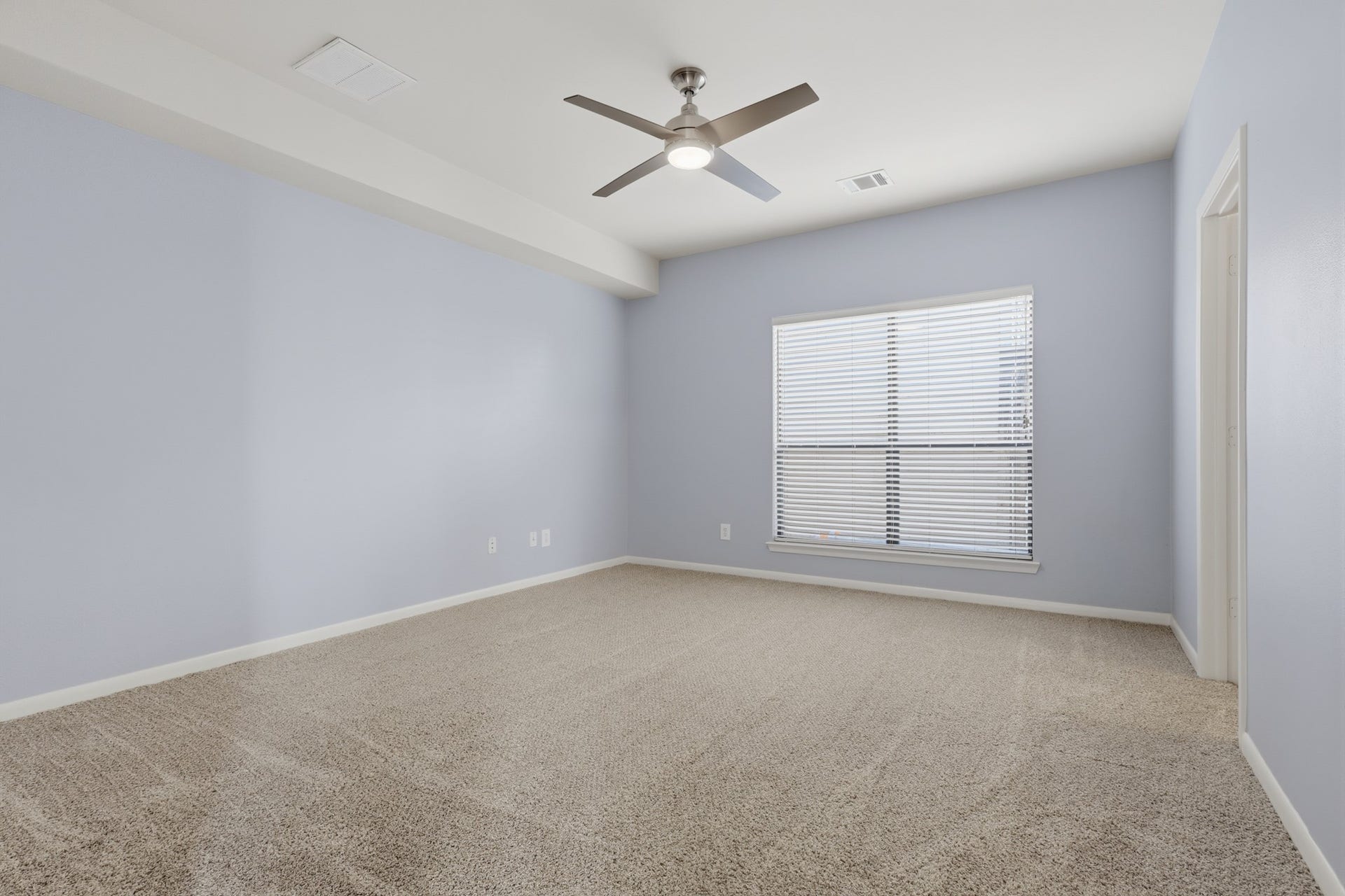 First floor secondary bedroom with natural light and a flexible layout, offering a comfortable space that can accommodate a variety of needs.