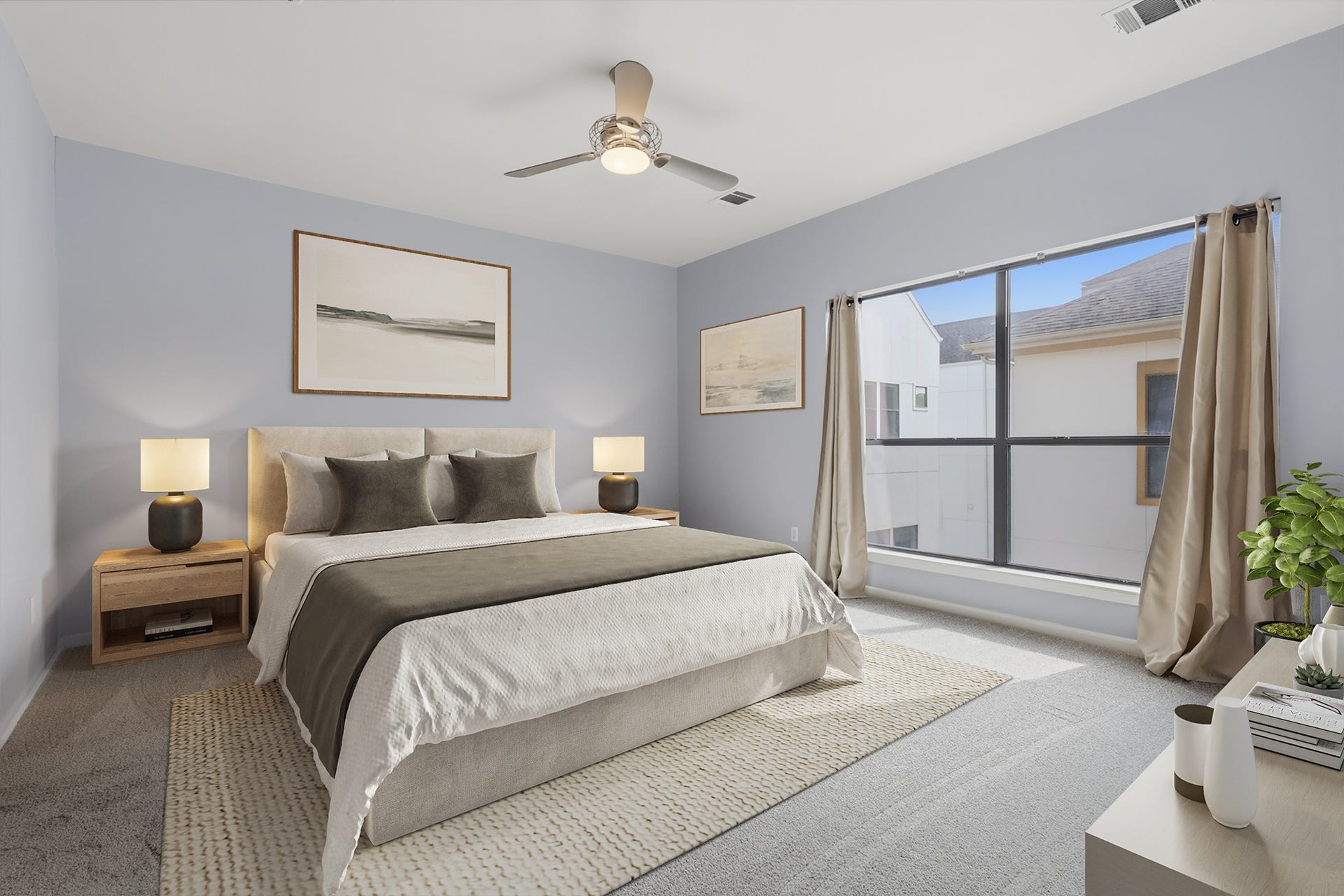 Virtually staged primary bedroom highlighting the generous proportions, large windows, and flexible space for additional furnishings.