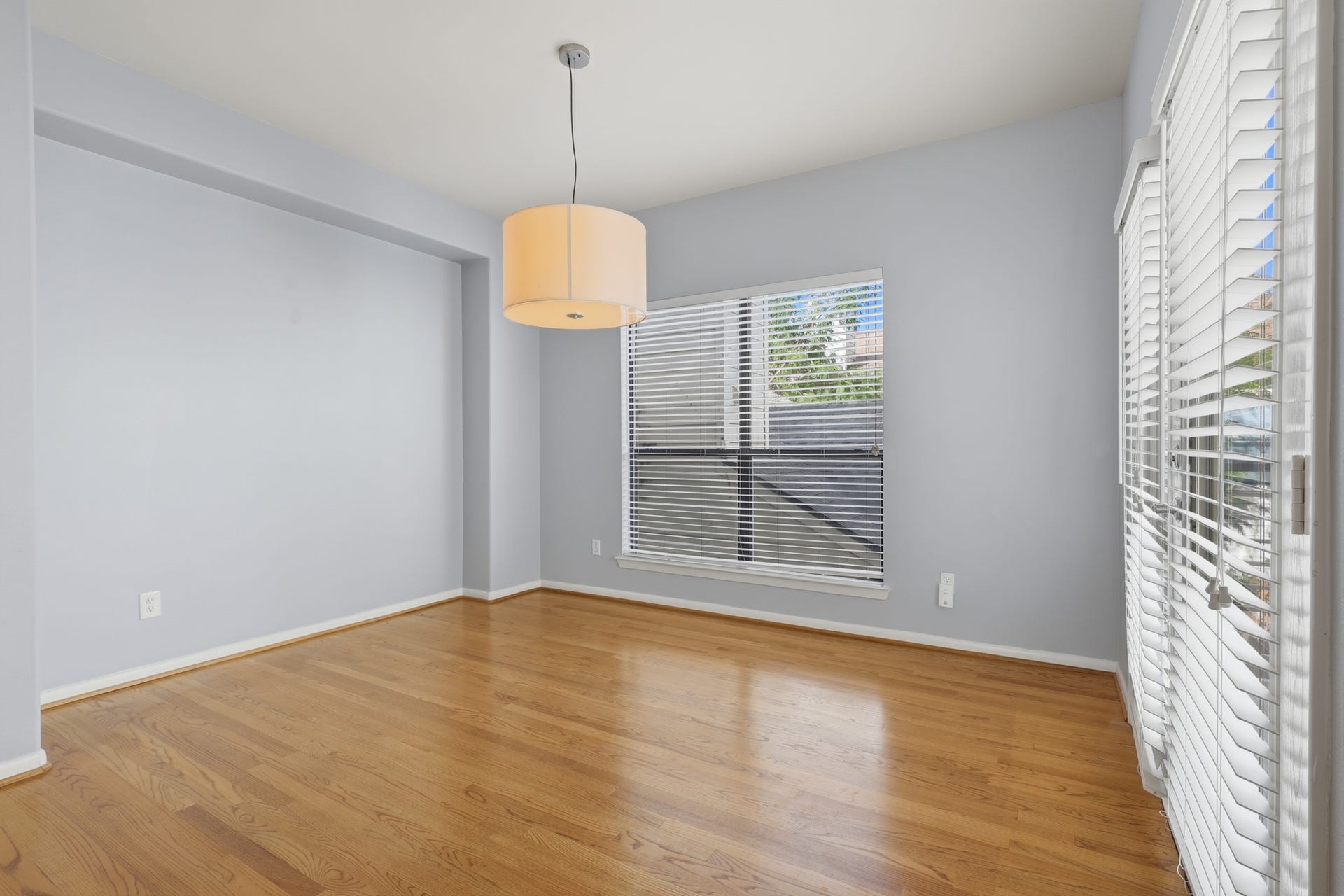 The generous windows and doors in the dedicated dining area create a bright and inviting setting for everyday living and entertaining.