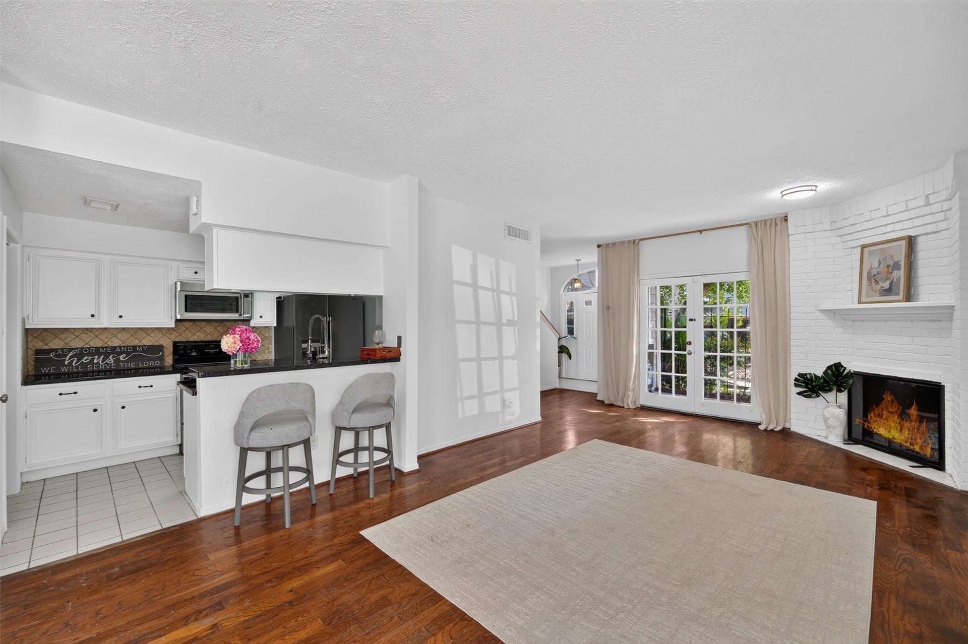 2220 Bering Drive, #12, Houston, TX 77057 Unstaged dining area with natural light and convenient access to the kitchen and living room.