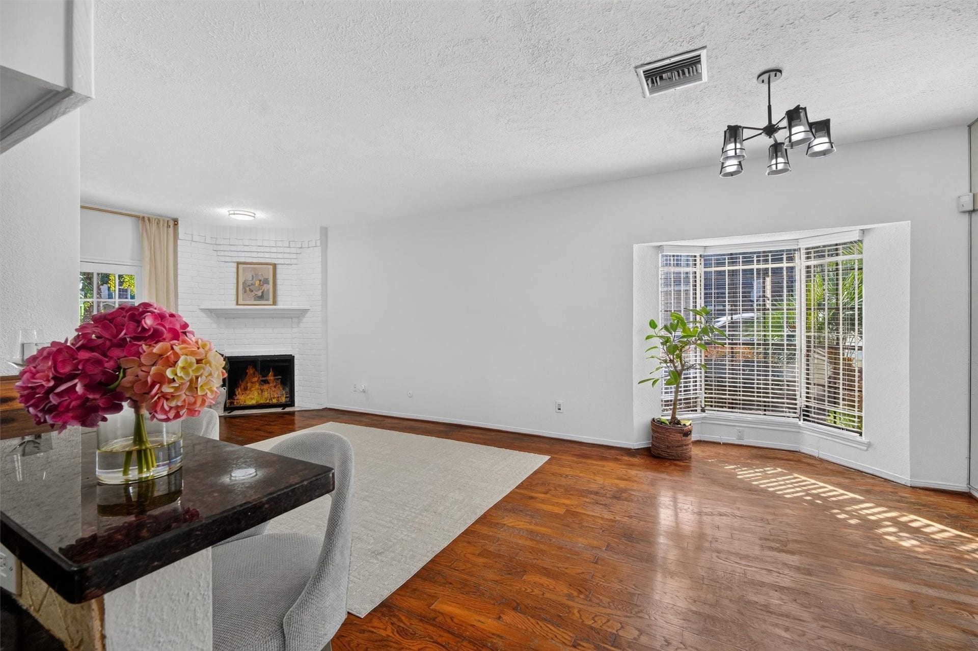 2220 Bering Drive, #12, Houston, TX 77057 Unstaged dining area with natural light and convenient access to the kitchen and living room.