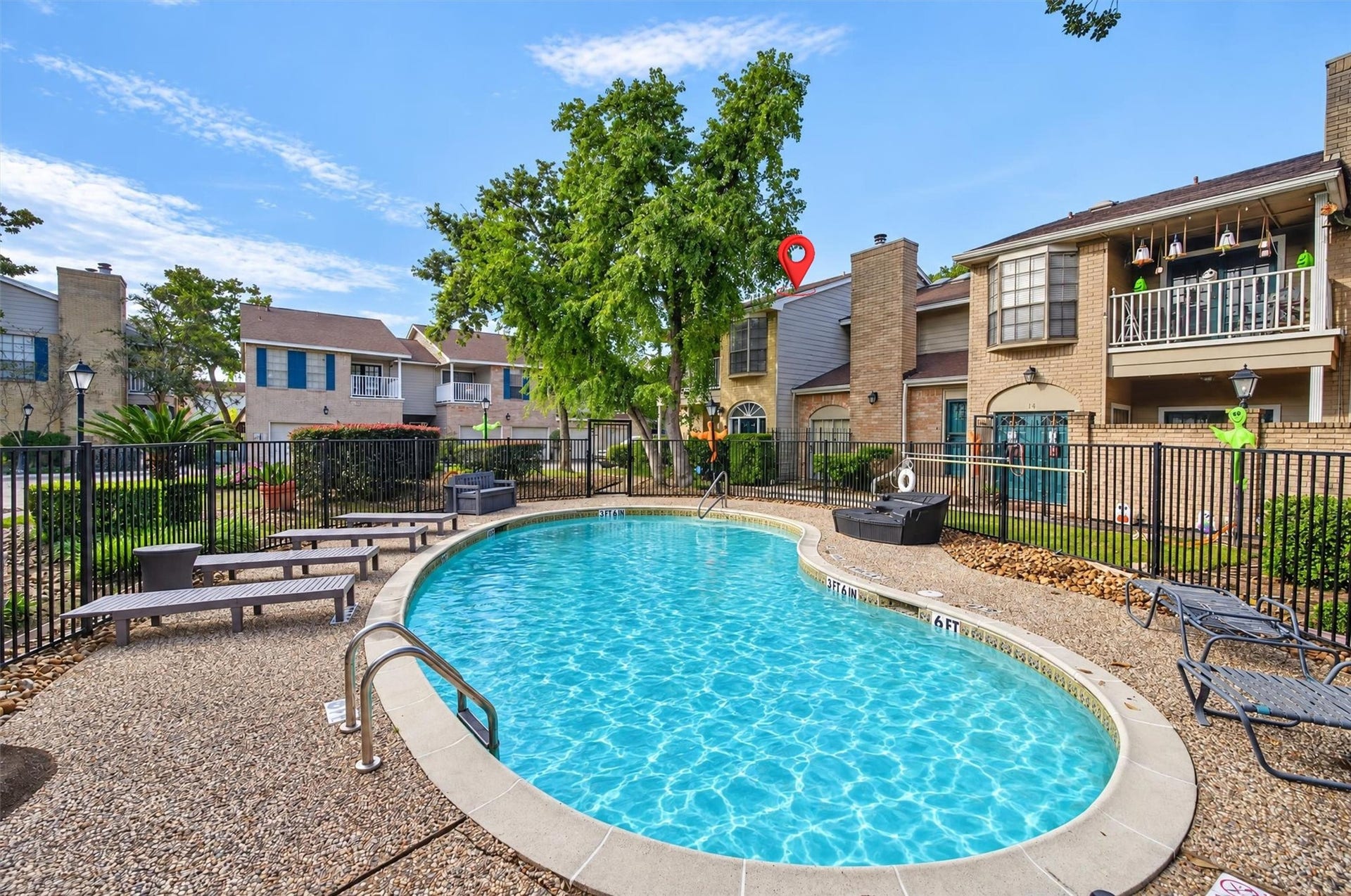 2220 Bering Drive, #12, Houston, TX 77057 Community pool surrounded by mature trees and landscaped gathering areas.