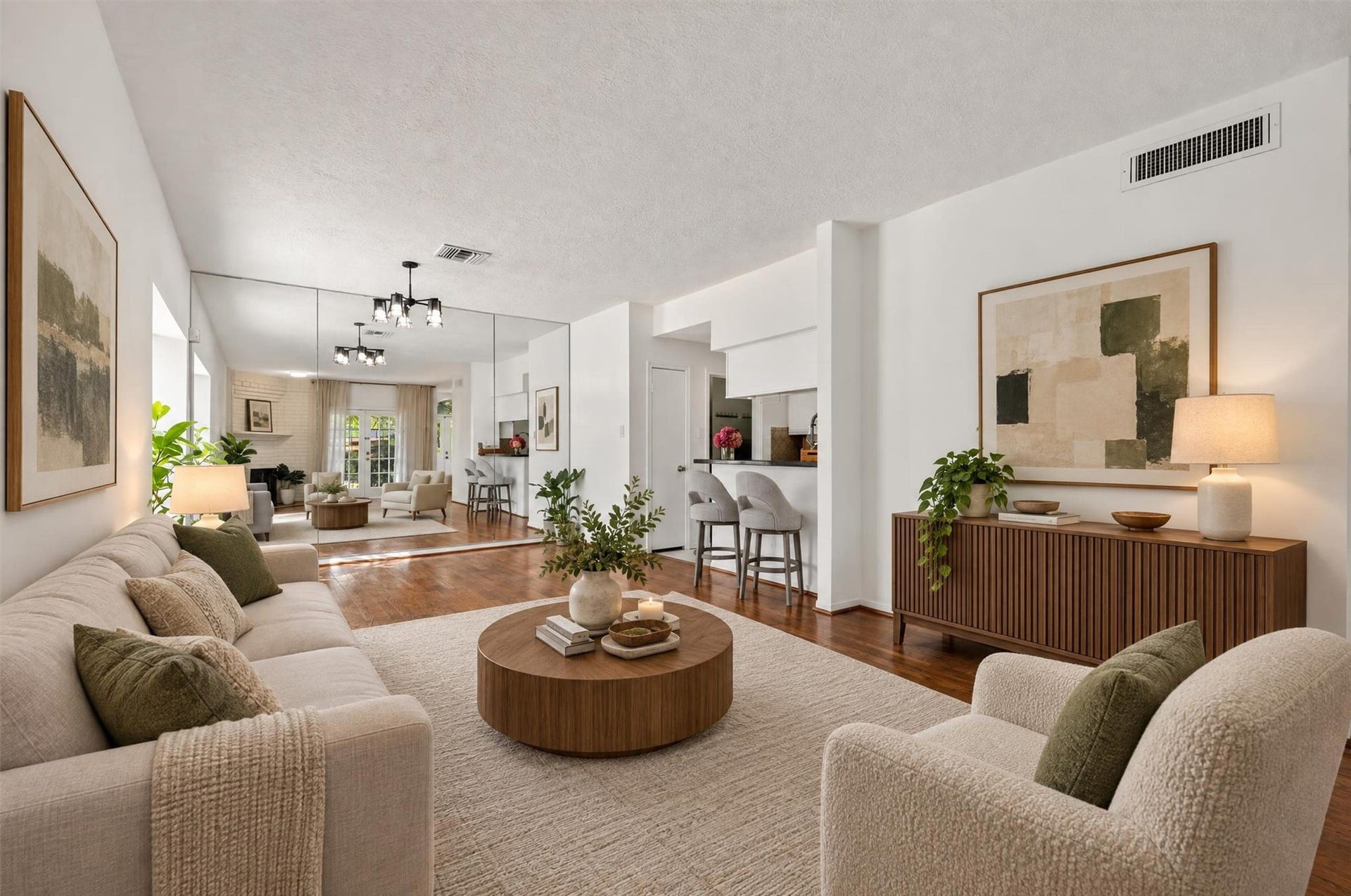 2220 Bering Drive, #12, Houston, TX 77057 An alternate view of the living room showcasing the flow toward the dining area and kitchen. Virtually staged.
