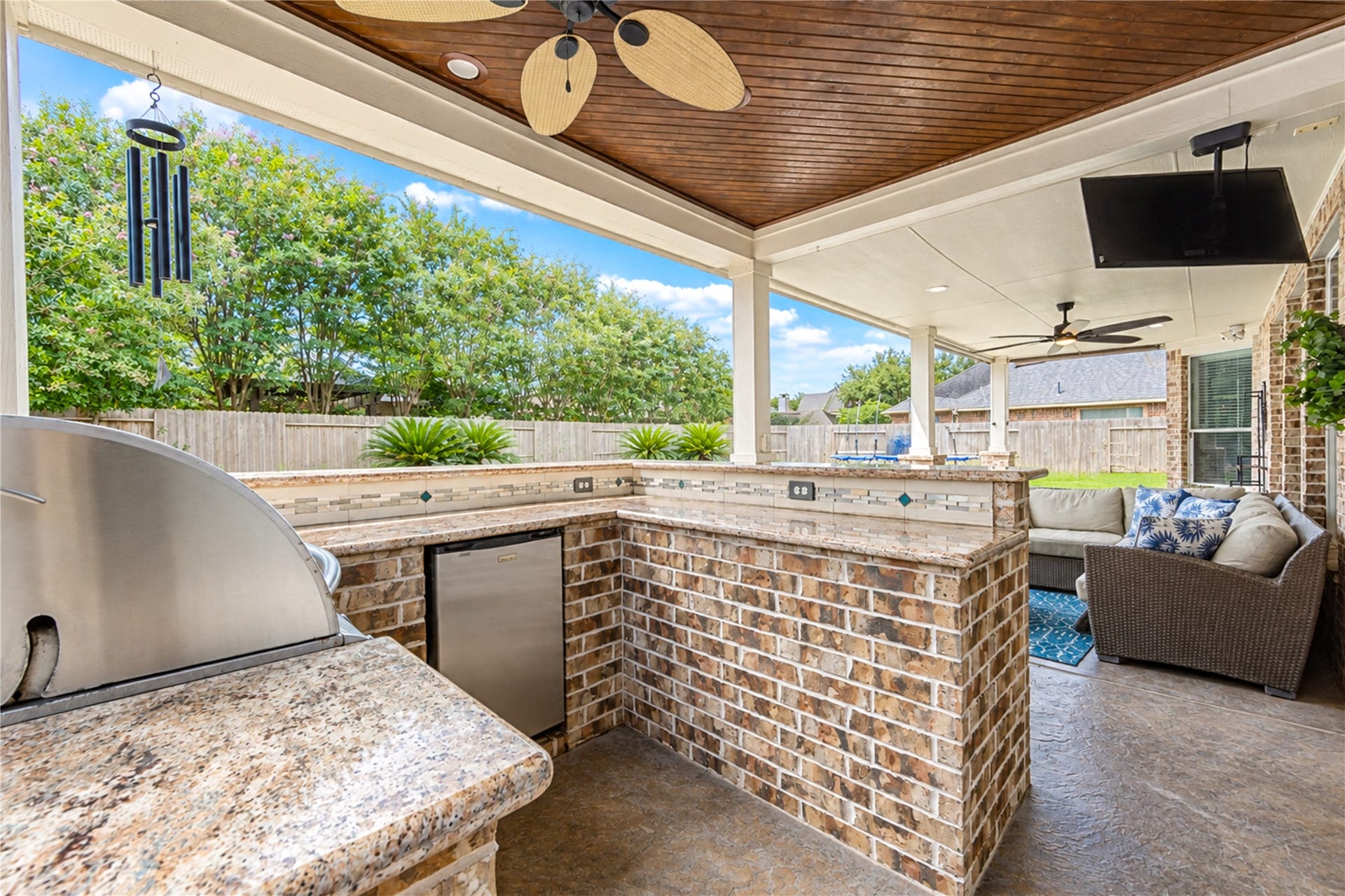 28019 Longspur Drive, Katy, TX 77494 Gas BBQ grill and small refrigerator and fan above.