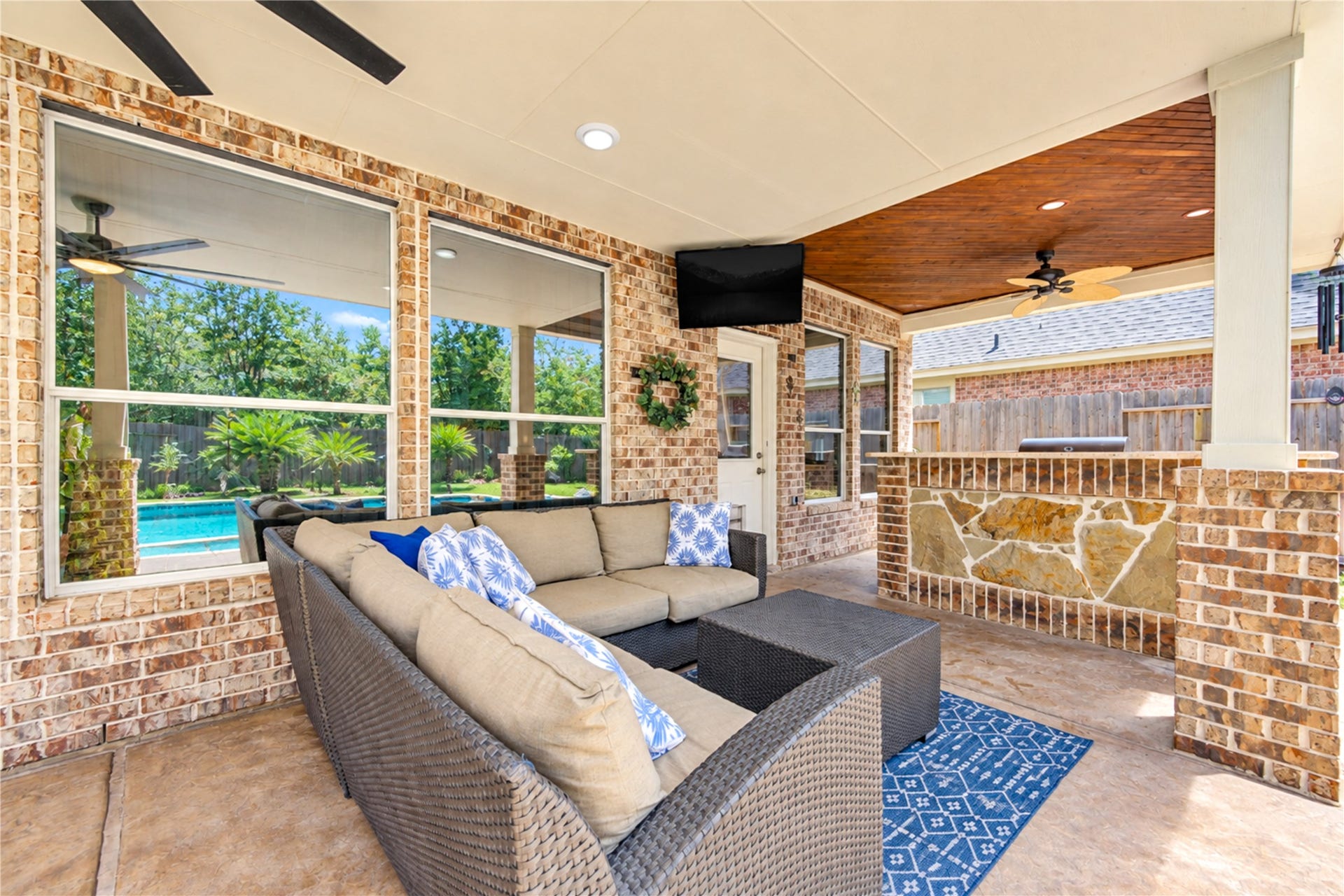 28019 Longspur Drive, Katy, TX 77494 External BBQ grill, large fan and TV.