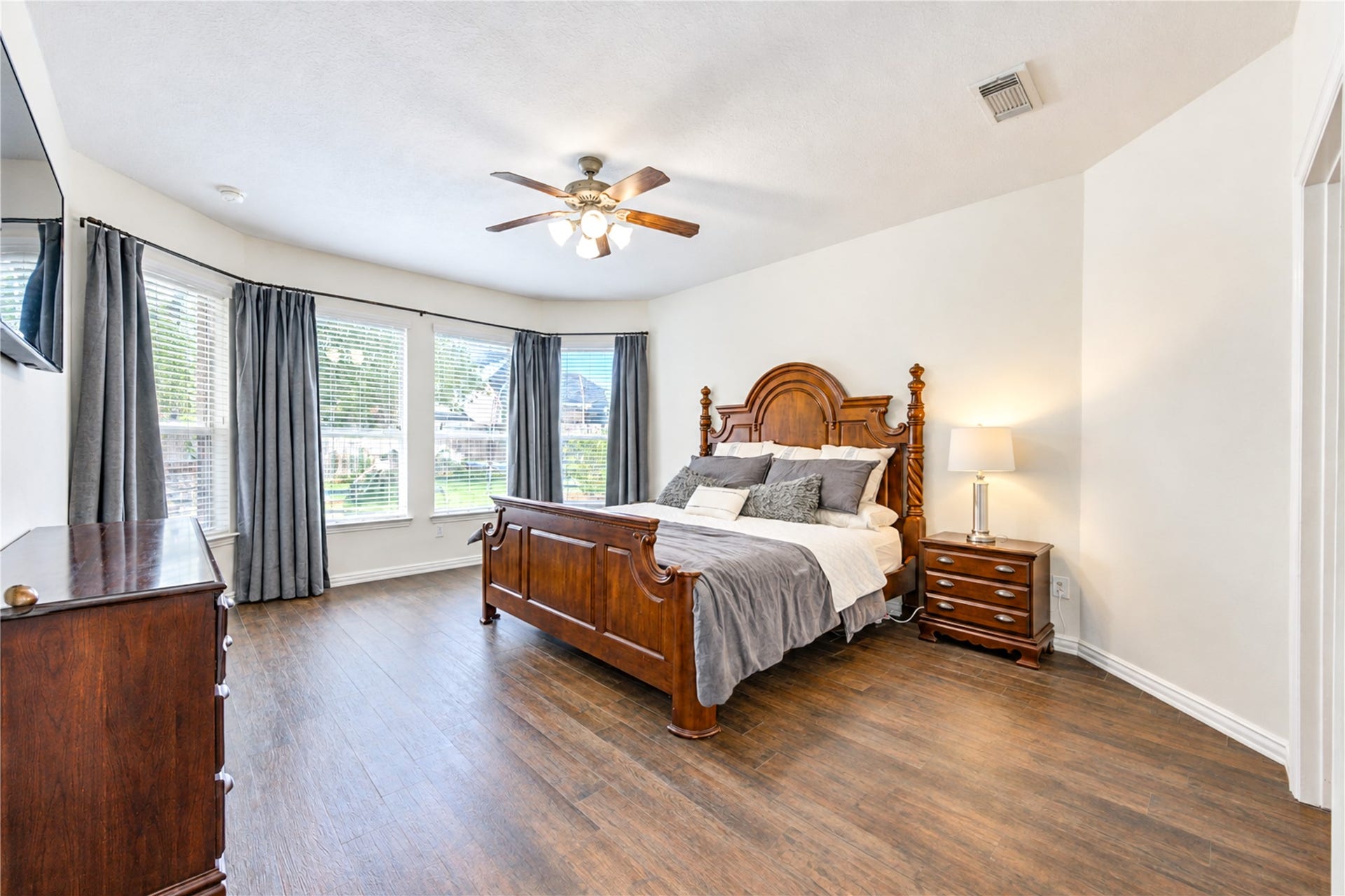 28019 Longspur Drive, Katy, TX 77494 Spacious primary bedroom with windows facing wonderful pool.