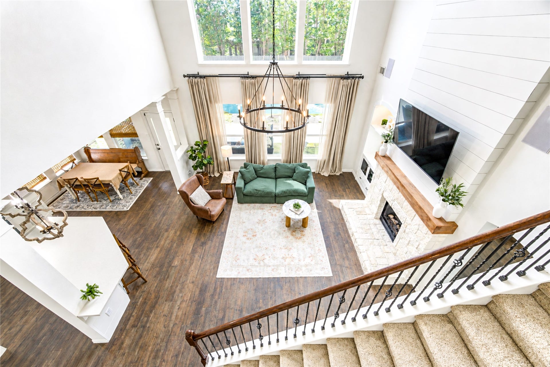 28019 Longspur Drive, Katy, TX 77494 Picture from top of stairs showing a beautiful family room. TV above the gaslog fireplace.
