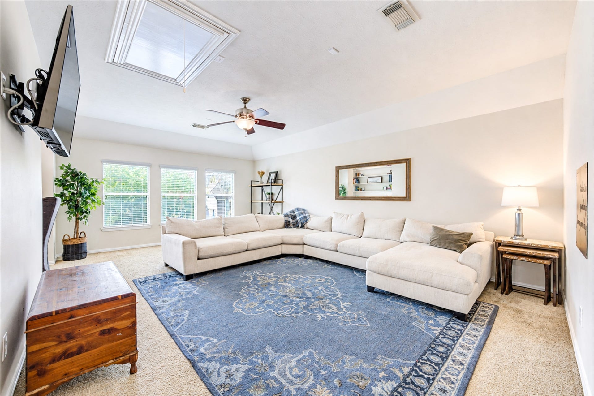 28019 Longspur Drive, Katy, TX 77494 large upstairs room with TV, fan and skylight