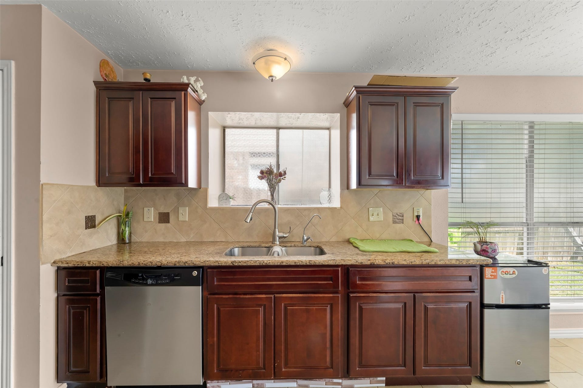 2033 Wildwood Ridge Drive, Missouri City, TX 77489 Efficient kitchen featuring abundant cabinetry providing generous storage space, complemented by durable countertops and sleek stainless steel appliances.