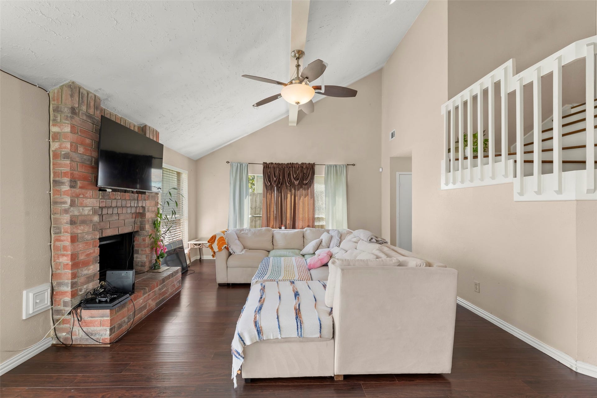 2033 Wildwood Ridge Drive, Missouri City, TX 77489 This living space is centered around a classic brick hearth.