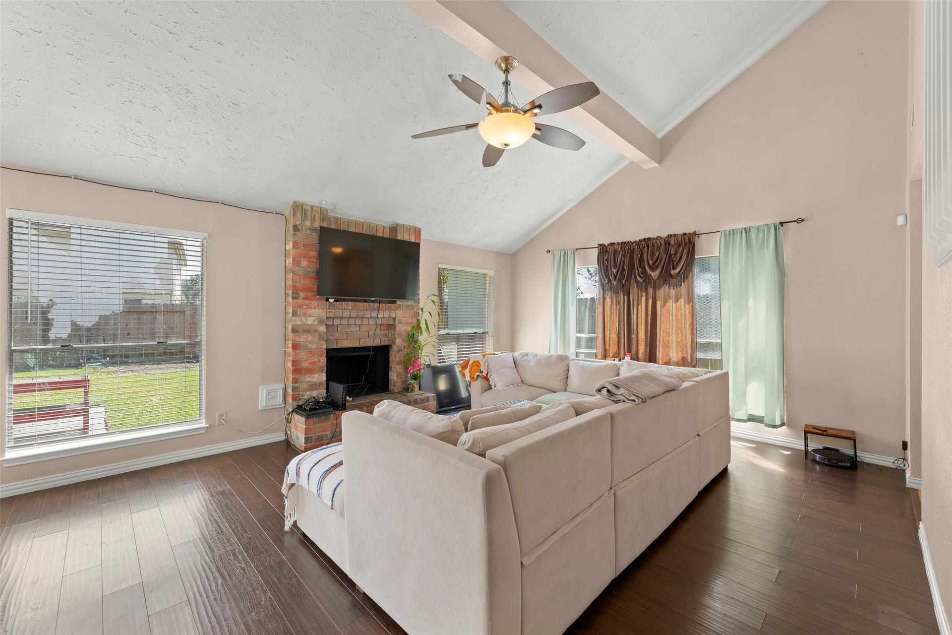 2033 Wildwood Ridge Drive, Missouri City, TX 77489 This open layout that seamlessly connects to the rest of the main level is accentuated by the dark oak staircase leading to the second floor.