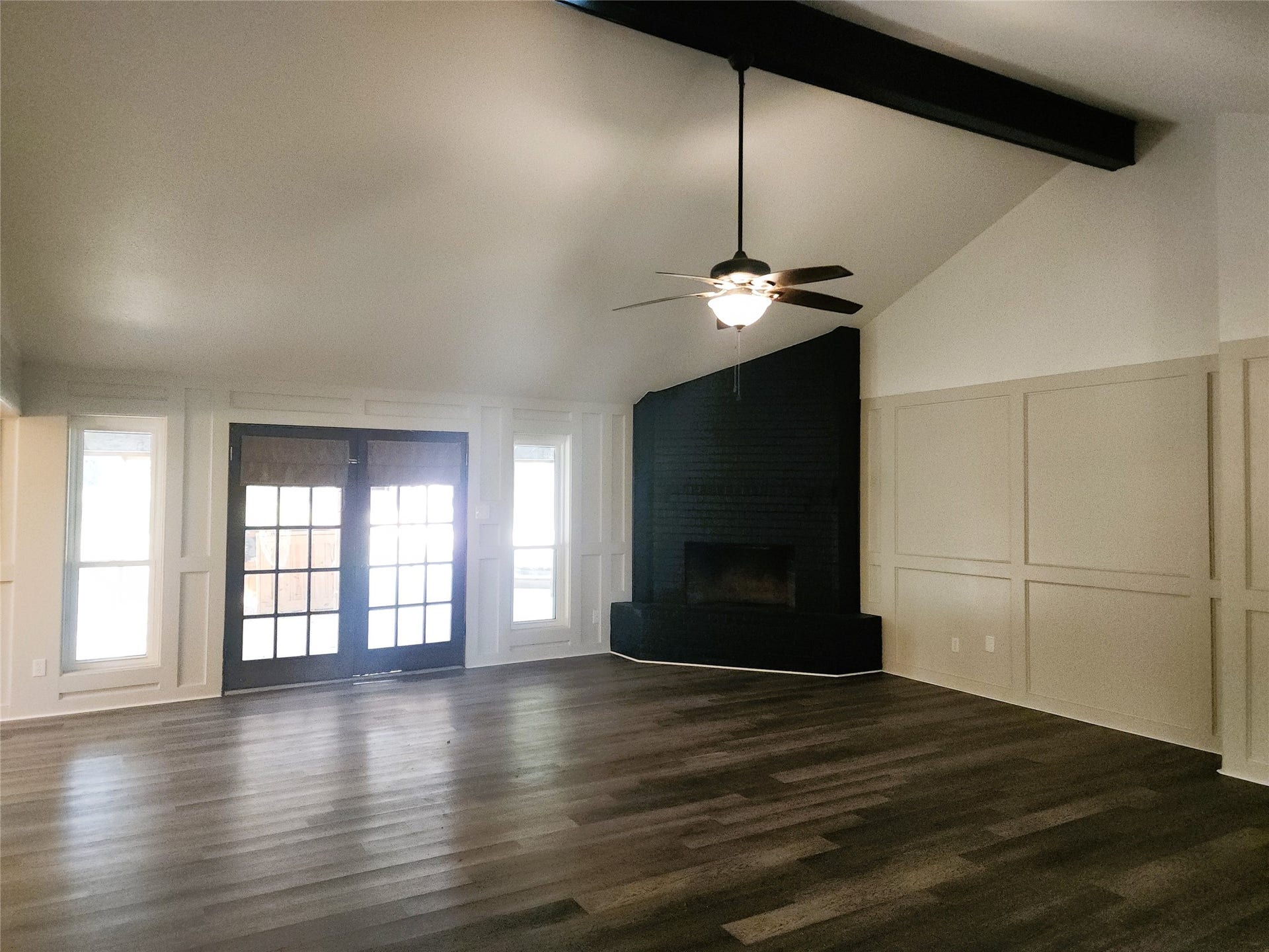 557 Fm 2693 Road E, New Waverly, TX 77358 Living room with French doors leading out to the covered patio and pool area.