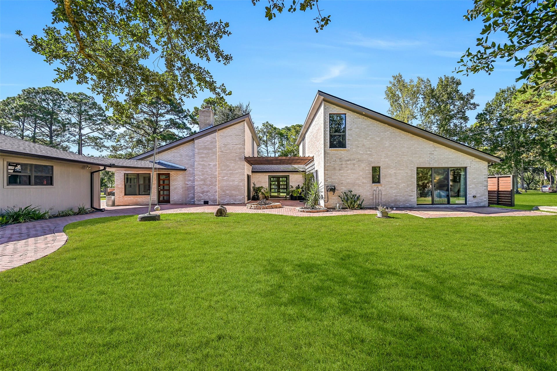 921 Falling Leaf Drive, Friendswood, TX 77546 The extensive renovation carried throughout this completely redesigned home, with major improvements including new electrical, plumbing, HVAC, windows & interior finishes in 2021, plus a new roof in 2025.