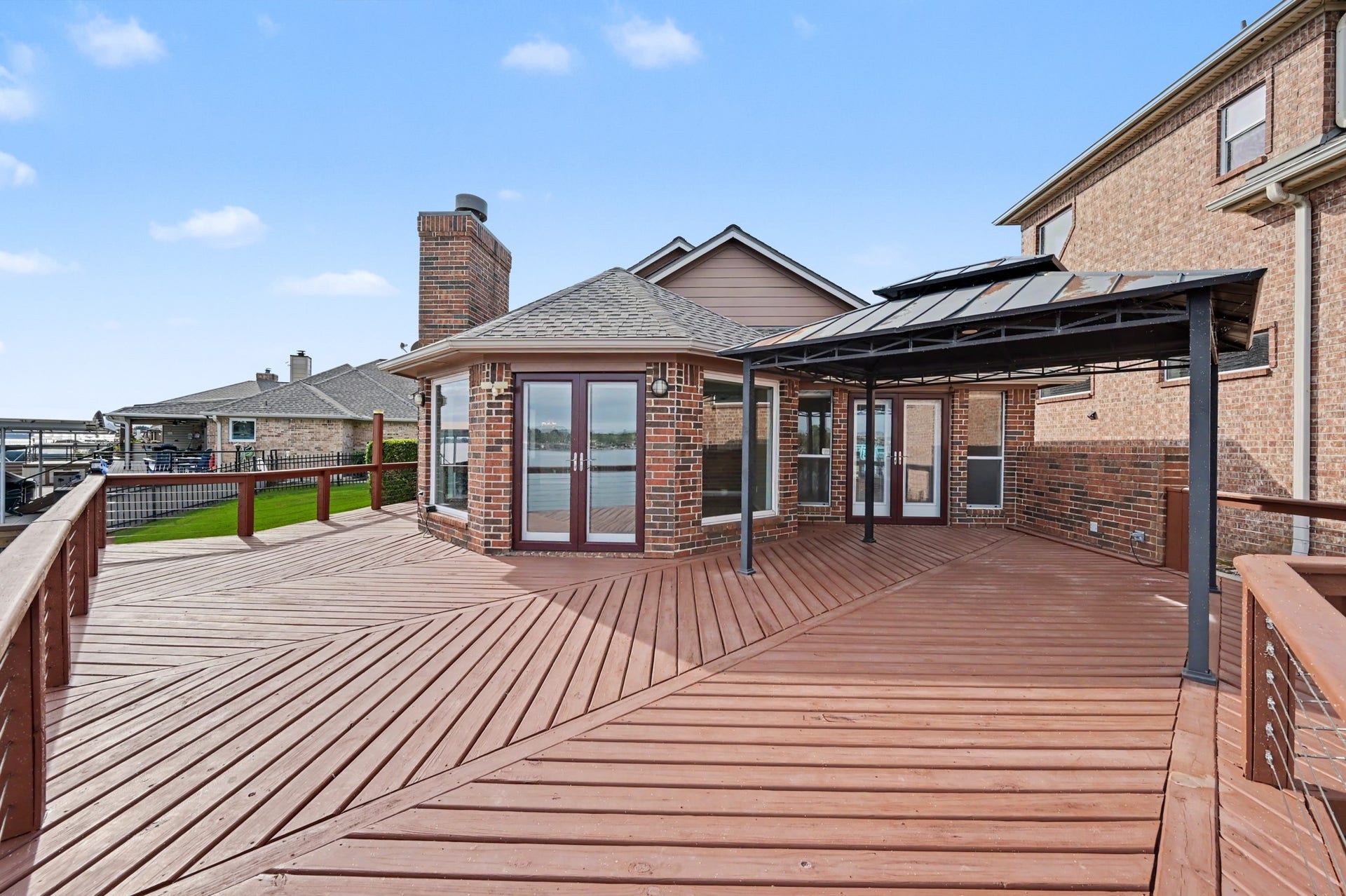 12842 Pelican Island Drive, Willis, TX 77318 Expansive patio deck with multiple access points from the home. Covered portion is ideal for a large table or seating arrangement.