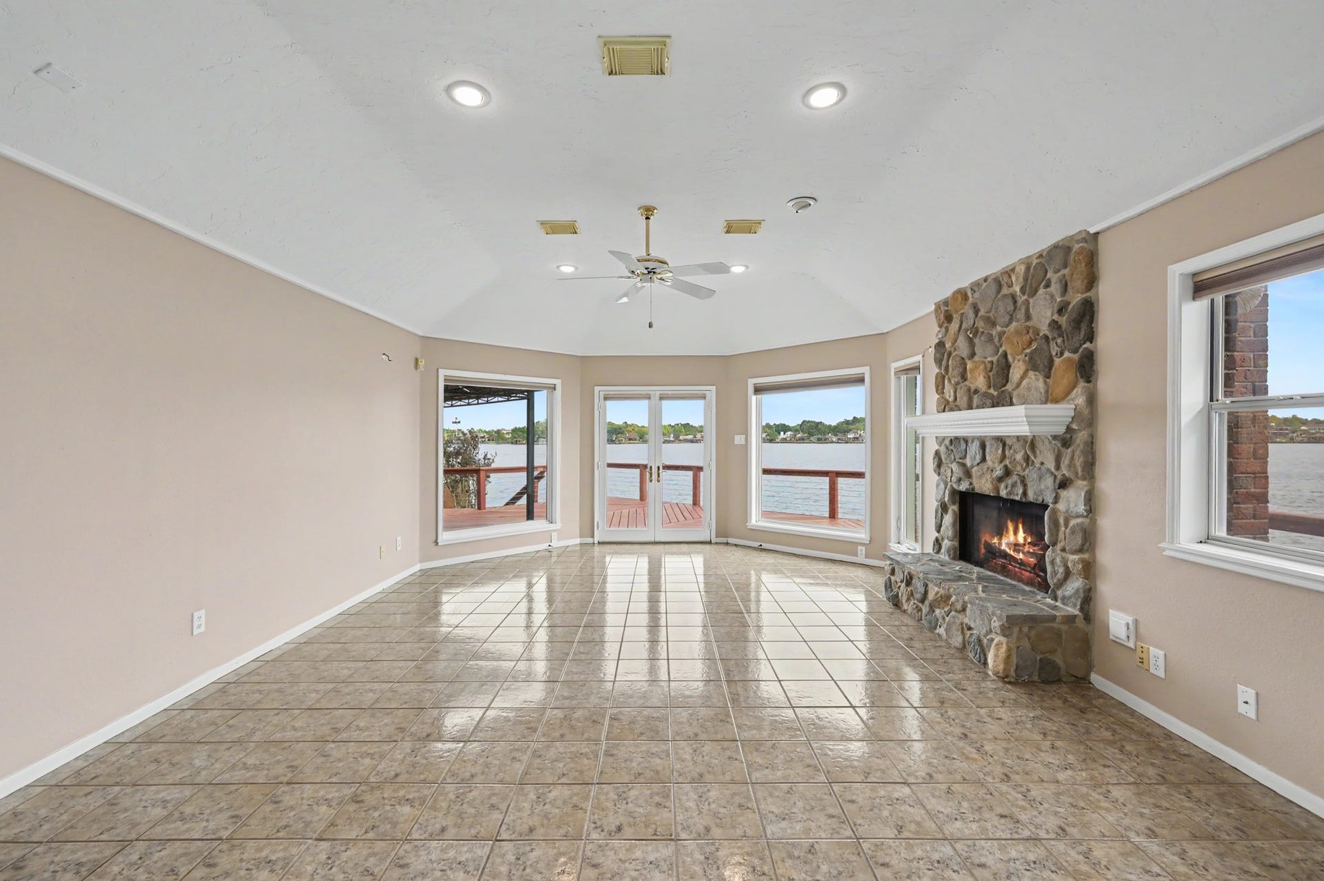 12842 Pelican Island Drive, Willis, TX 77318 Living Area with French Doors to escape to the deck.