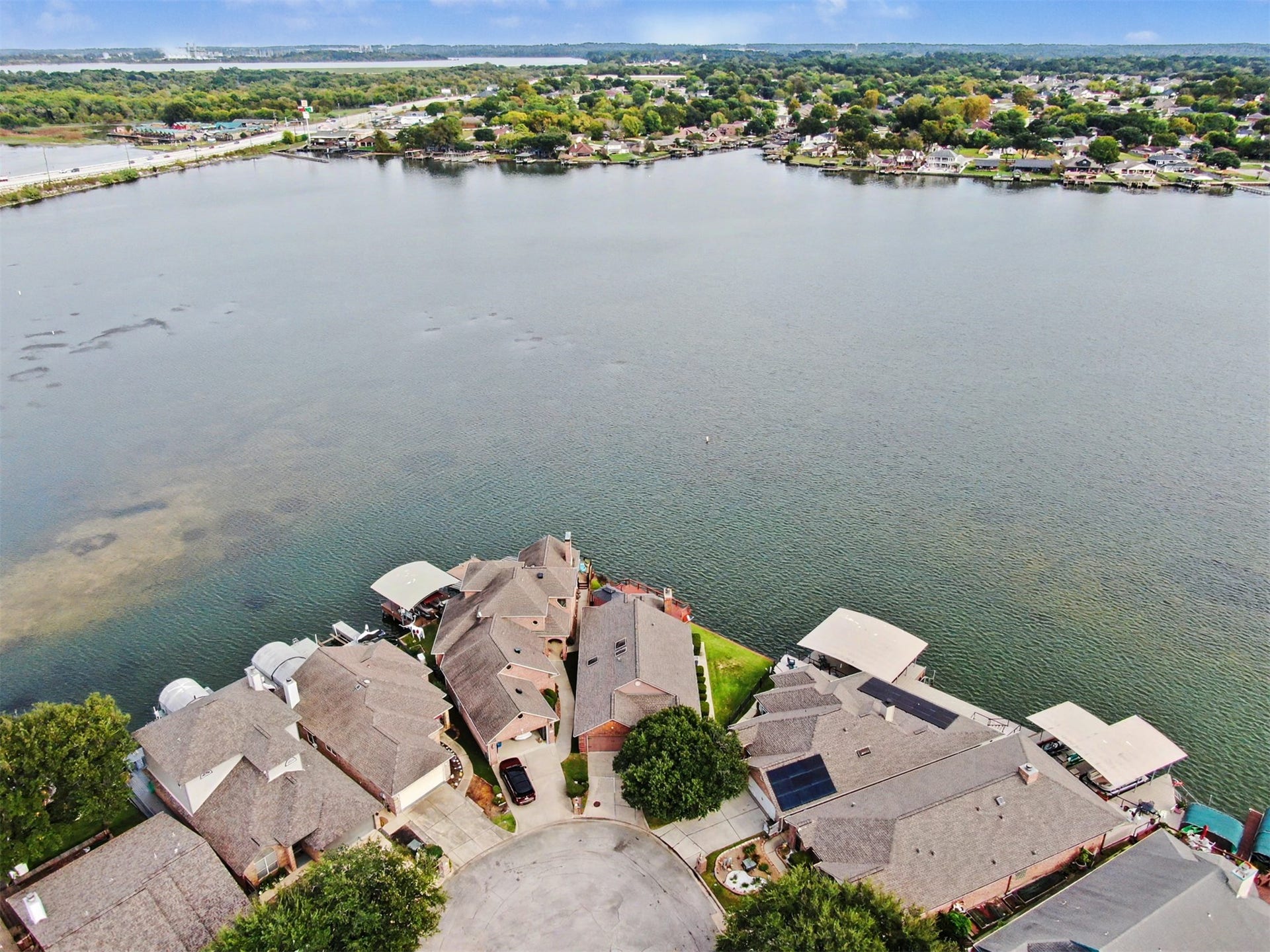 12842 Pelican Island Drive, Willis, TX 77318 Additional Aerial View. One might notice the sand bar around the island. This helps protect the properties from boats traveling at high speeds.
