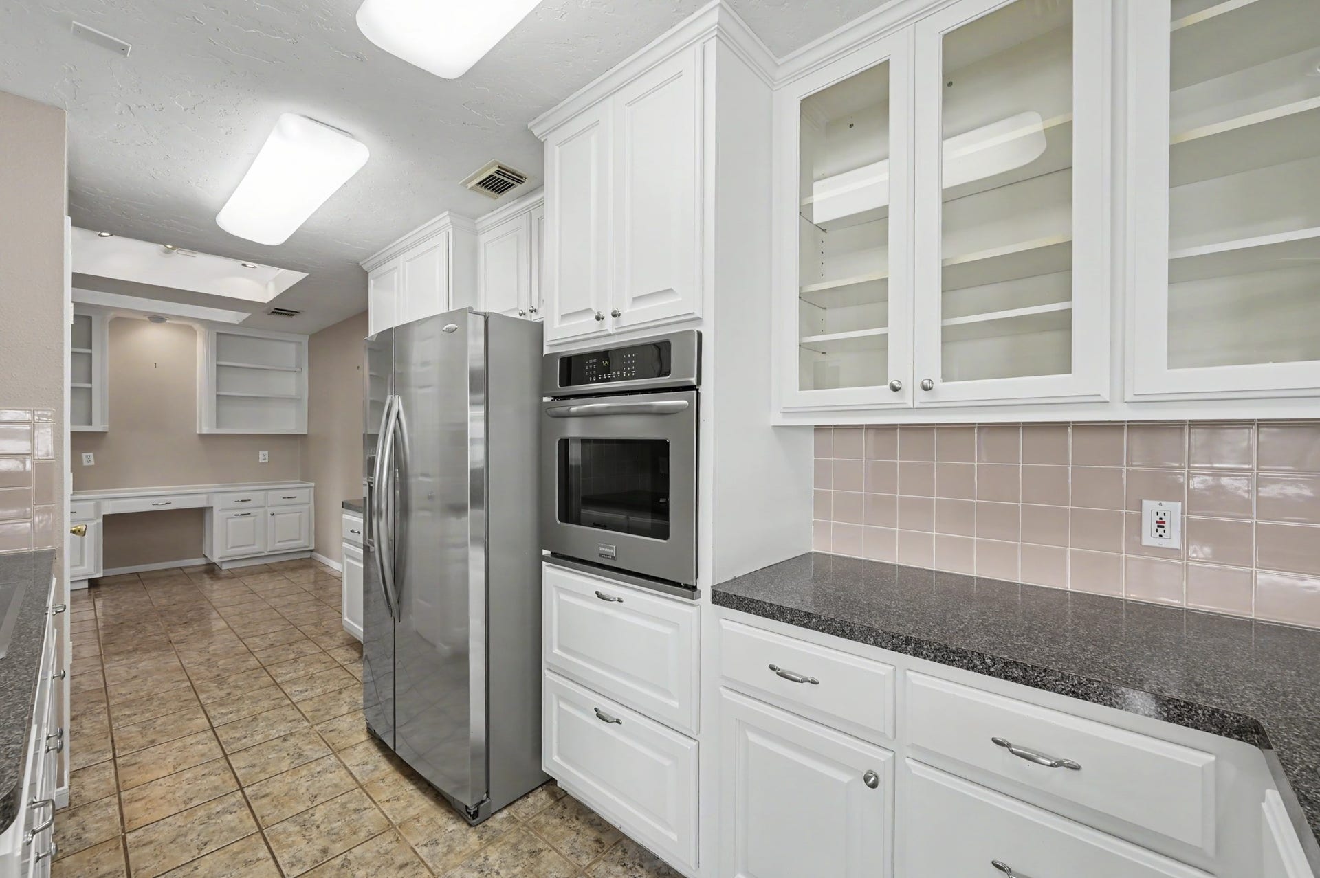 12842 Pelican Island Drive, Willis, TX 77318 Kitchen opens to the Breakfast Area and office space.