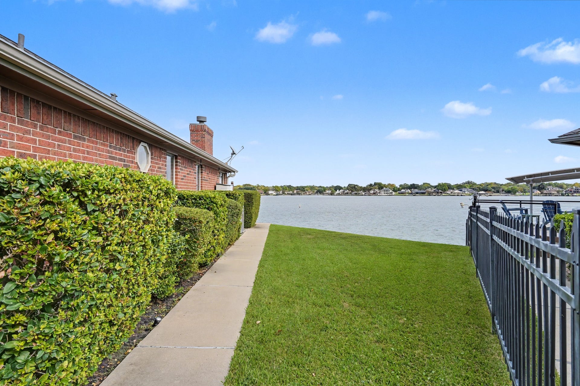 12842 Pelican Island Drive, Willis, TX 77318 Green Space with sidewalk to the deck.