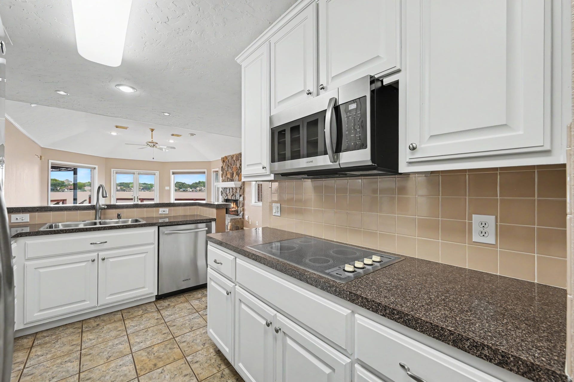 12842 Pelican Island Drive, Willis, TX 77318 Cooktop and built-in microwave.