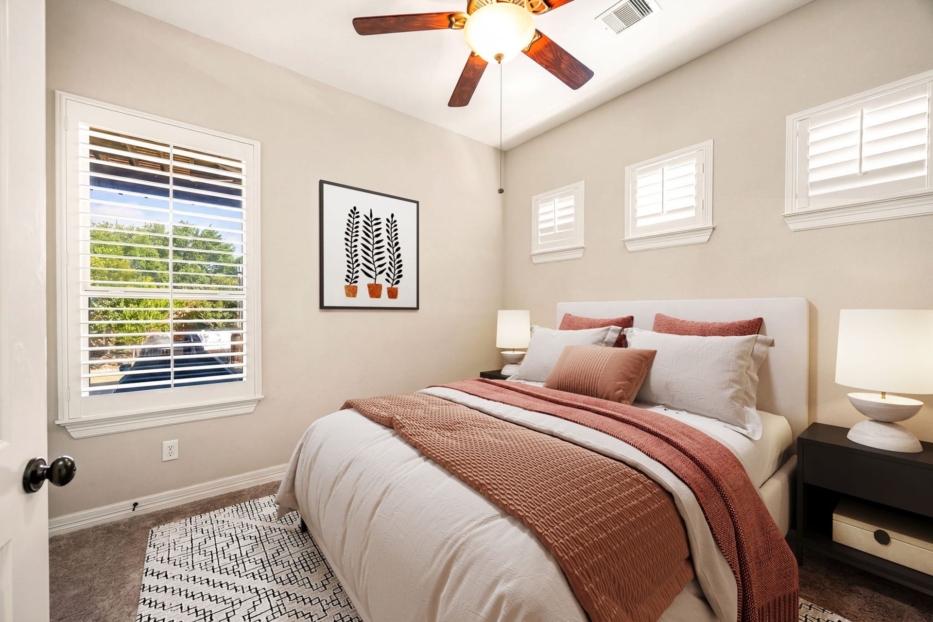 5102 Hawthorne Bend Drive, Katy, TX 77494 The perfect guest retreat! This cozy first floor bedroom features plush carpet, plantation shutters, vaulted ceiling, and a ceiling fan, comfortable and inviting for any guest. *Virtually Staged