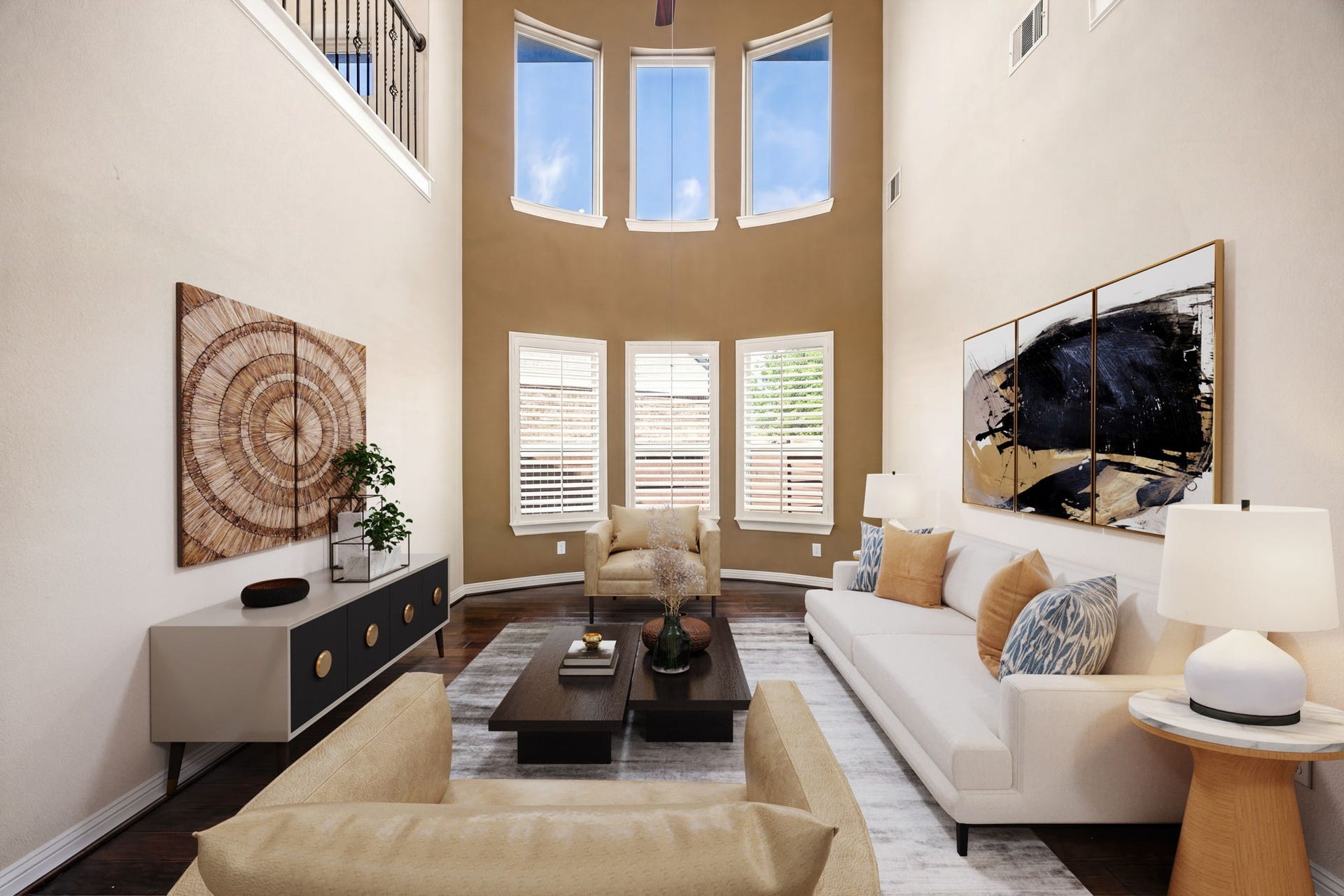 5102 Hawthorne Bend Drive, Katy, TX 77494 Breathtaking two-story formal living room with soaring ceilings, rich hardwood floors, and floor-to-ceiling windows that bathe the space in natural light. Plantation shutters, a curved accent wall, and an iron-railed balcony overhead make this space as grand as it is inviting. *Virtually Staged