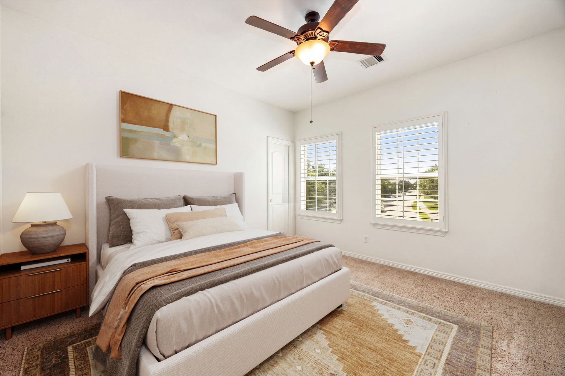 5102 Hawthorne Bend Drive, Katy, TX 77494 Bright and airy secondary bedroom featuring plush carpet, plantation shutters, and a ceiling fan, filled with natural light and ready to make your own! *Virtually Staged