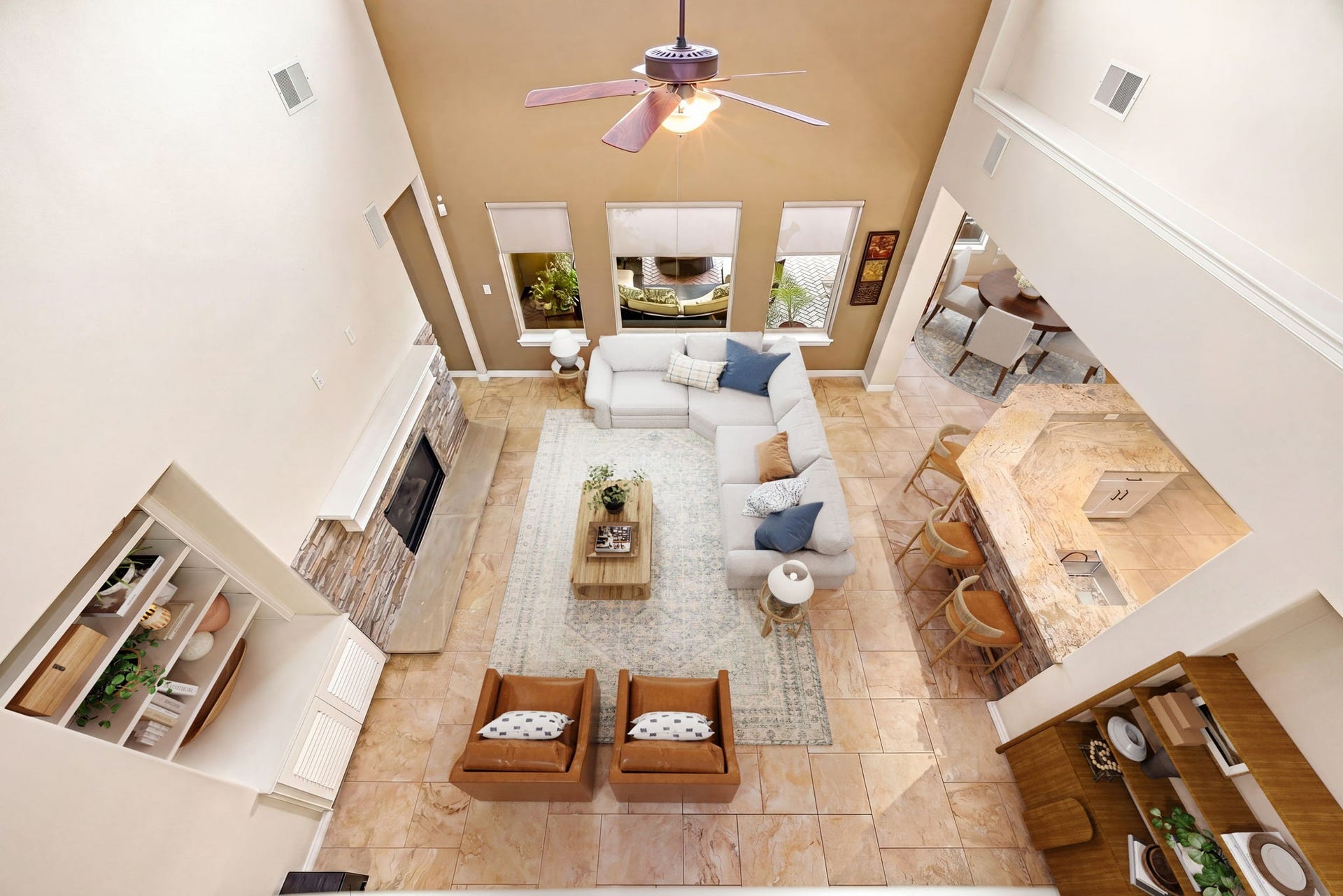 5102 Hawthorne Bend Drive, Katy, TX 77494 This stunning bird's eye shot shows just how grand and open this floor plan truly is, soaring two-story ceilings, stacked stone fireplace, built-in shelving, and a seamless flow into the kitchen and dining area. Space, style, and function all in one! *Virtually Staged