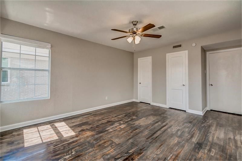 3502 Rosedale Street, Houston, TX 77004 Sleek hardwood floors, a ceiling fan for comfort, and ample natural light streaming through a large window.