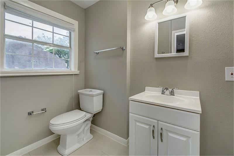 3502 Rosedale Street, Houston, TX 77004 Bathroom featuring a modern vanity, sleek fixtures, and a large window for natural light.