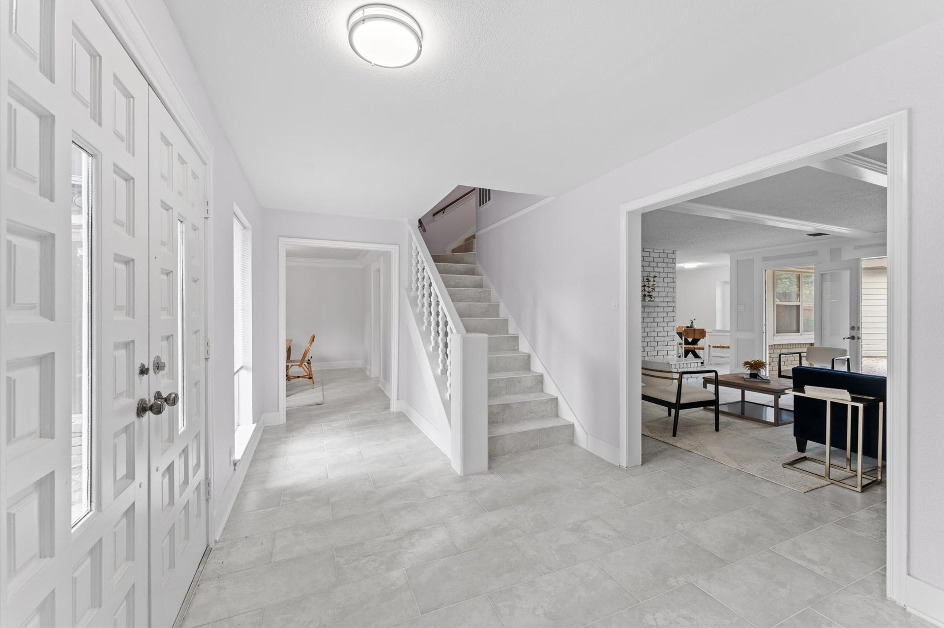 Pristine tile flooring runs continuously throughout the main living spaces, ensuring a stylish, durable floor plan.
