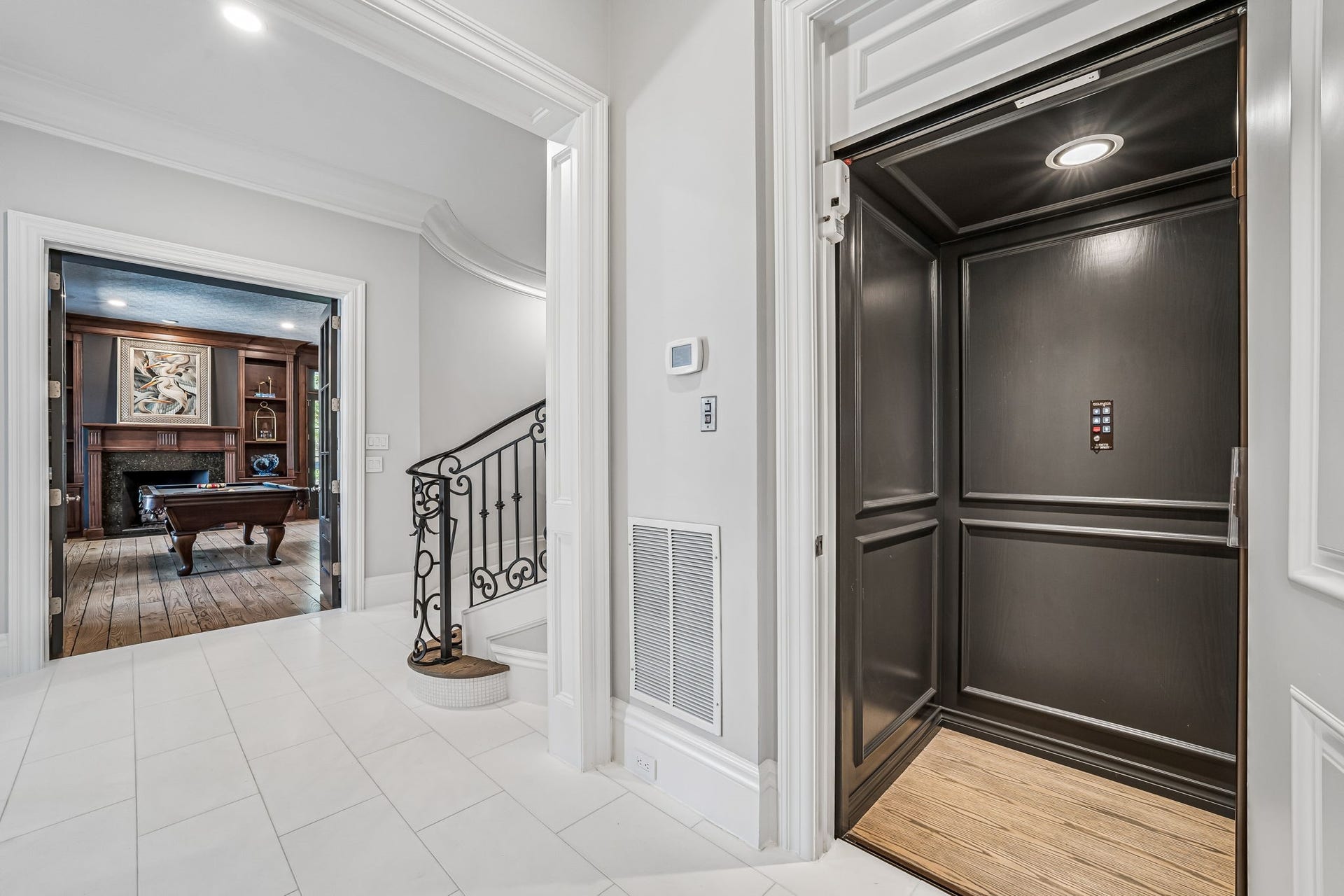 2 Georgian Row, The Woodlands, TX 77380 A private elevator provides convenient access to all three levels of the residence, seamlessly combining functionality with the homes grand scale.