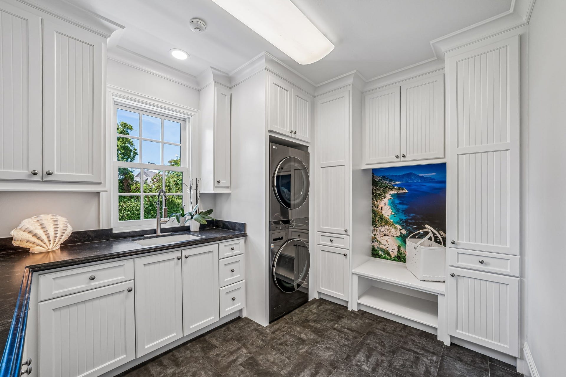 2 Georgian Row, The Woodlands, TX 77380 Main utility room, window, sink, and enough room for a refrigerator.