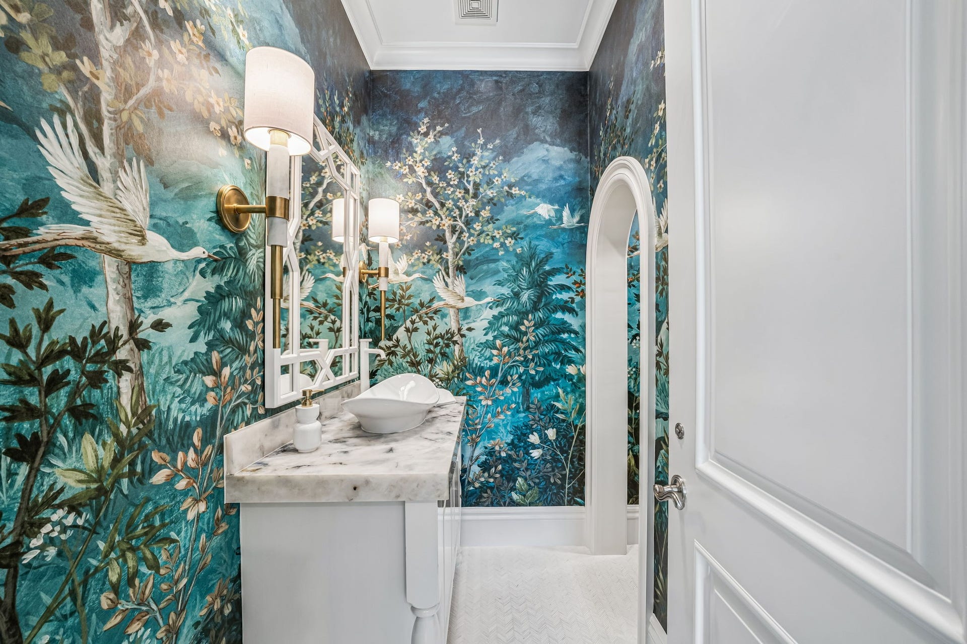 2 Georgian Row, The Woodlands, TX 77380 Powder room with beautiful quartzite, designer wallpaper, and marble flooring.