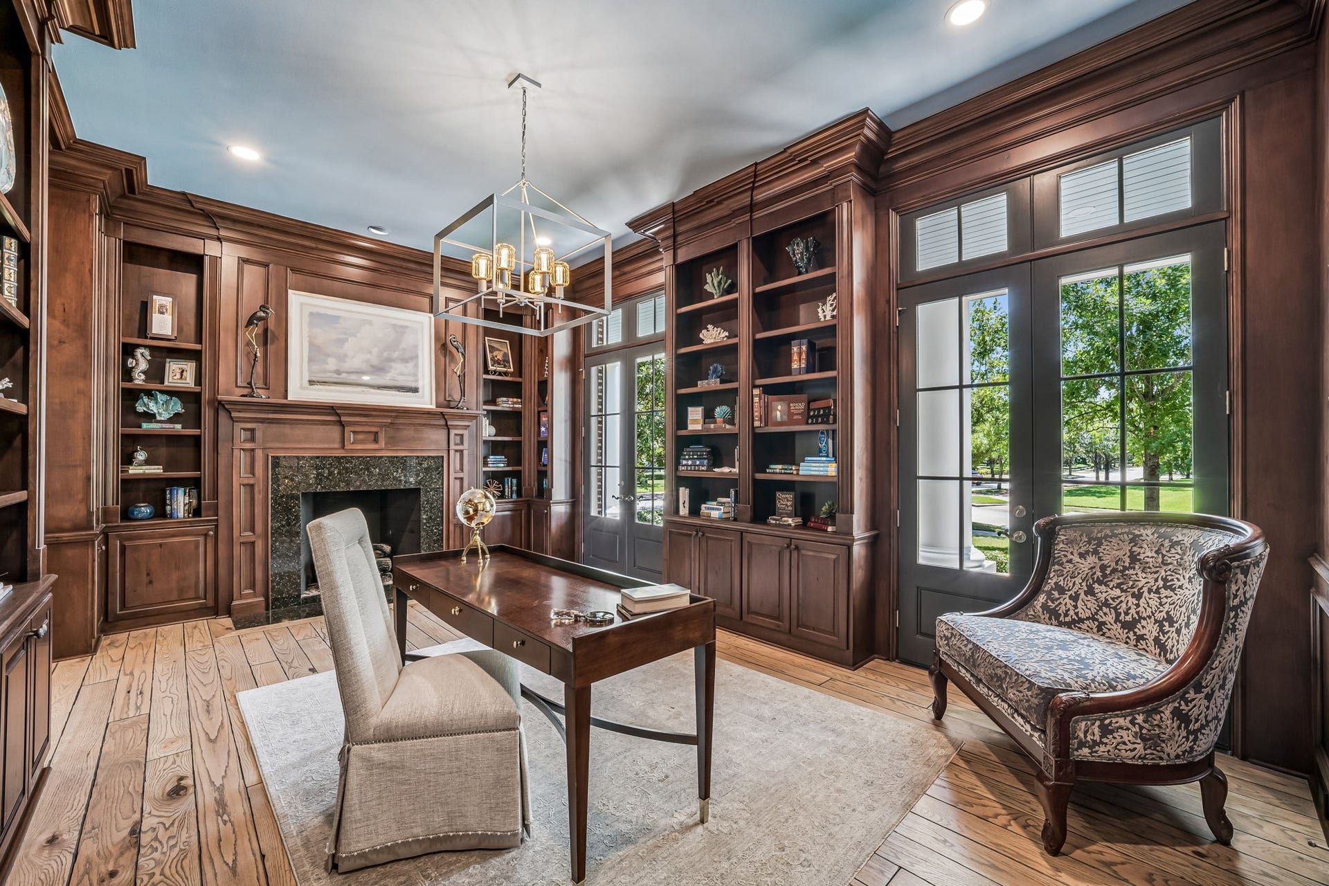 2 Georgian Row, The Woodlands, TX 77380 French doors fill the private study with natural light and open directly to the expansive veranda, creating a seamless connection to the homes beautifully landscaped surroundings.