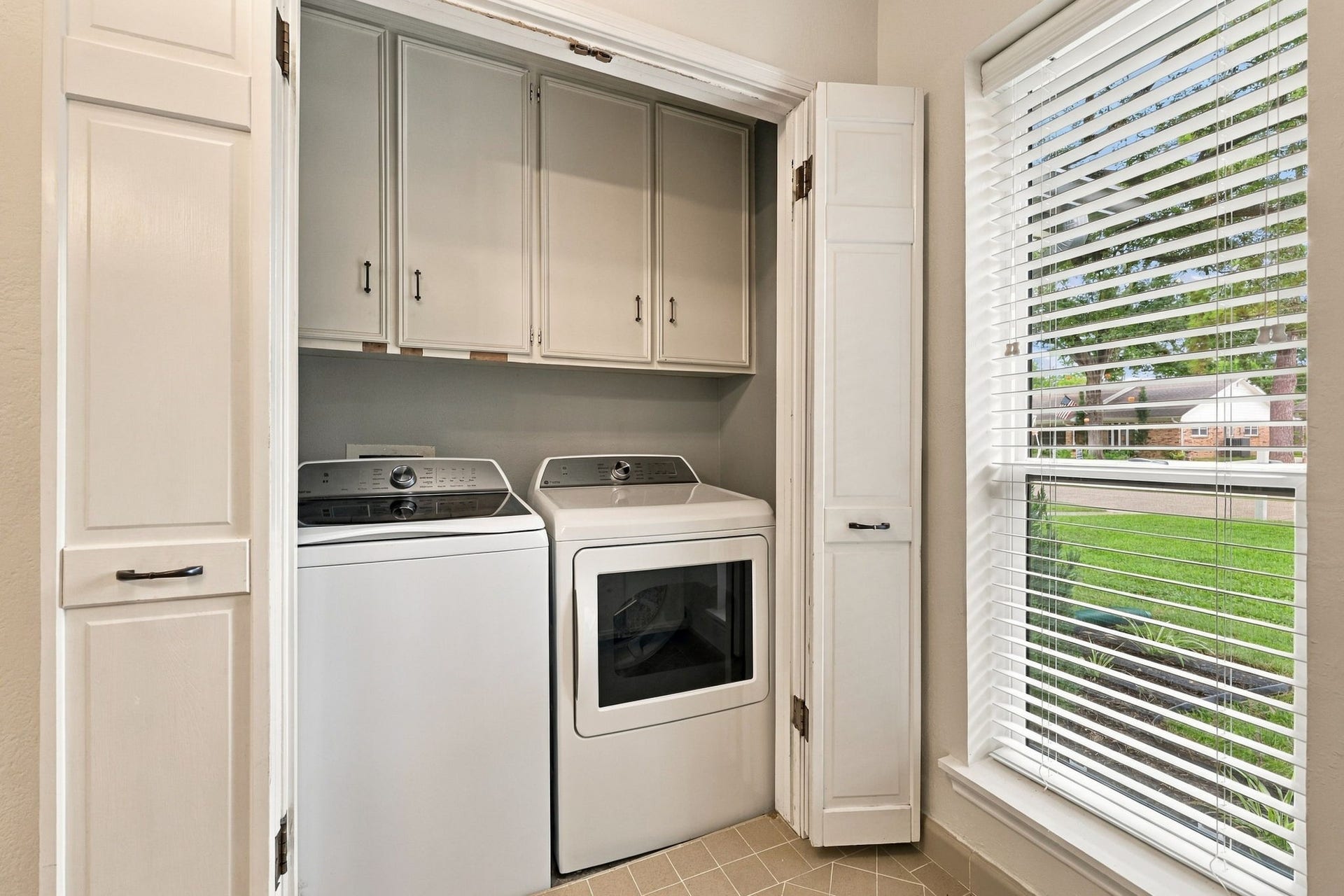 11307 Valley Spring Drive, Houston, TX 77043 Washer/dryer in guest bath.