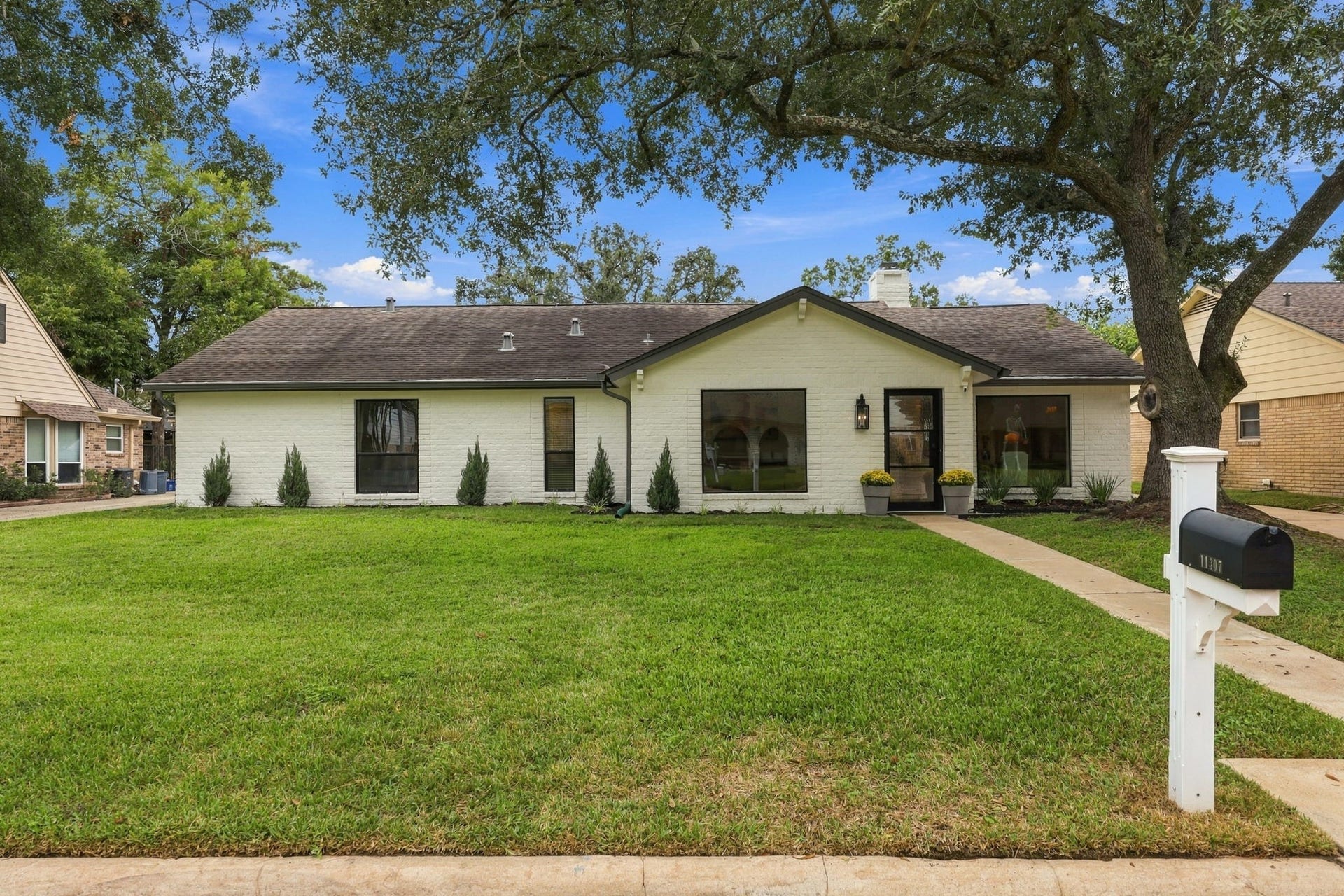 11307 Valley Spring Drive, Houston, TX 77043 Beautiful oak tree in the front yard.
