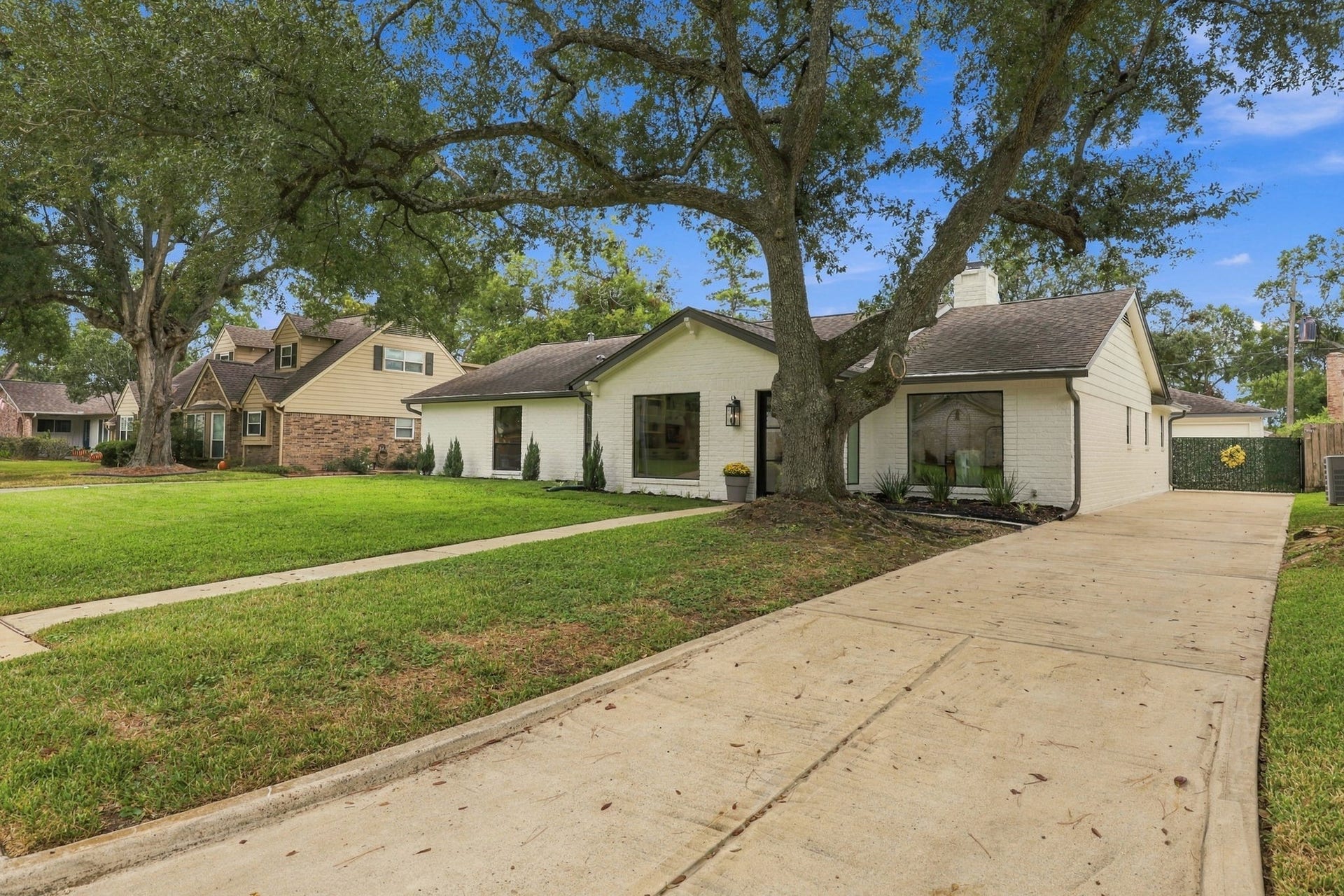 11307 Valley Spring Drive, Houston, TX 77043 This long driveway is gated and leads to a 2 car garage.