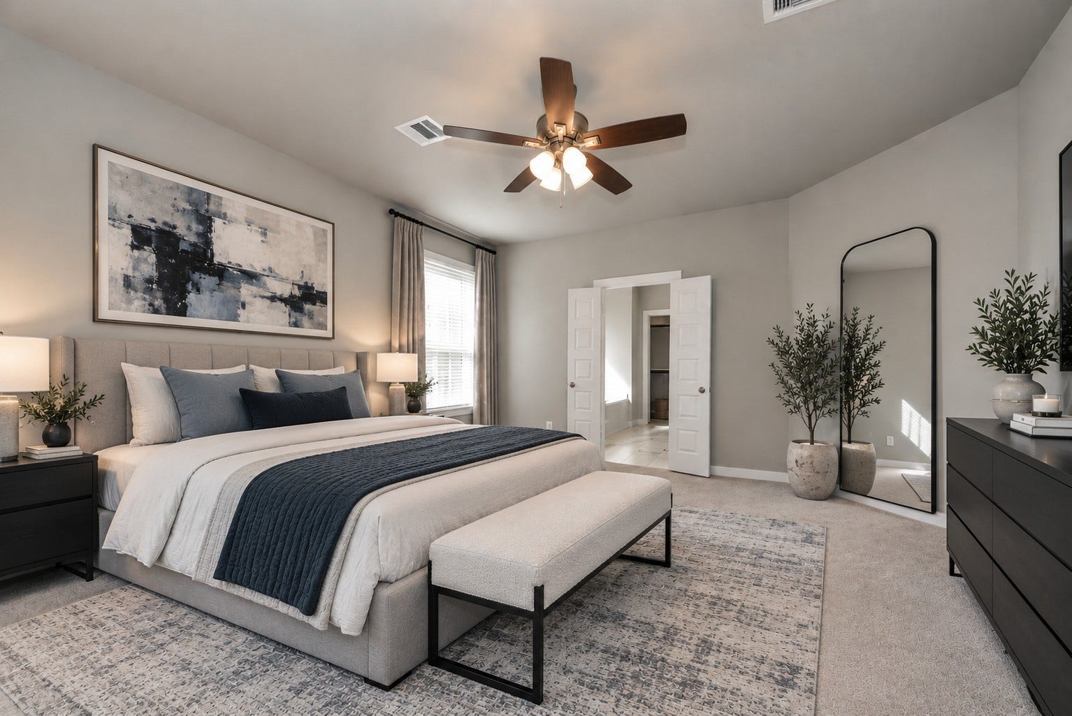Modern bedroom featuring a cozy bed with green accents, stylish artwork, and a functional workspace with built-in shelving, ideal for relaxation and productivity. *This is virtually staged to illustrate potential layout.