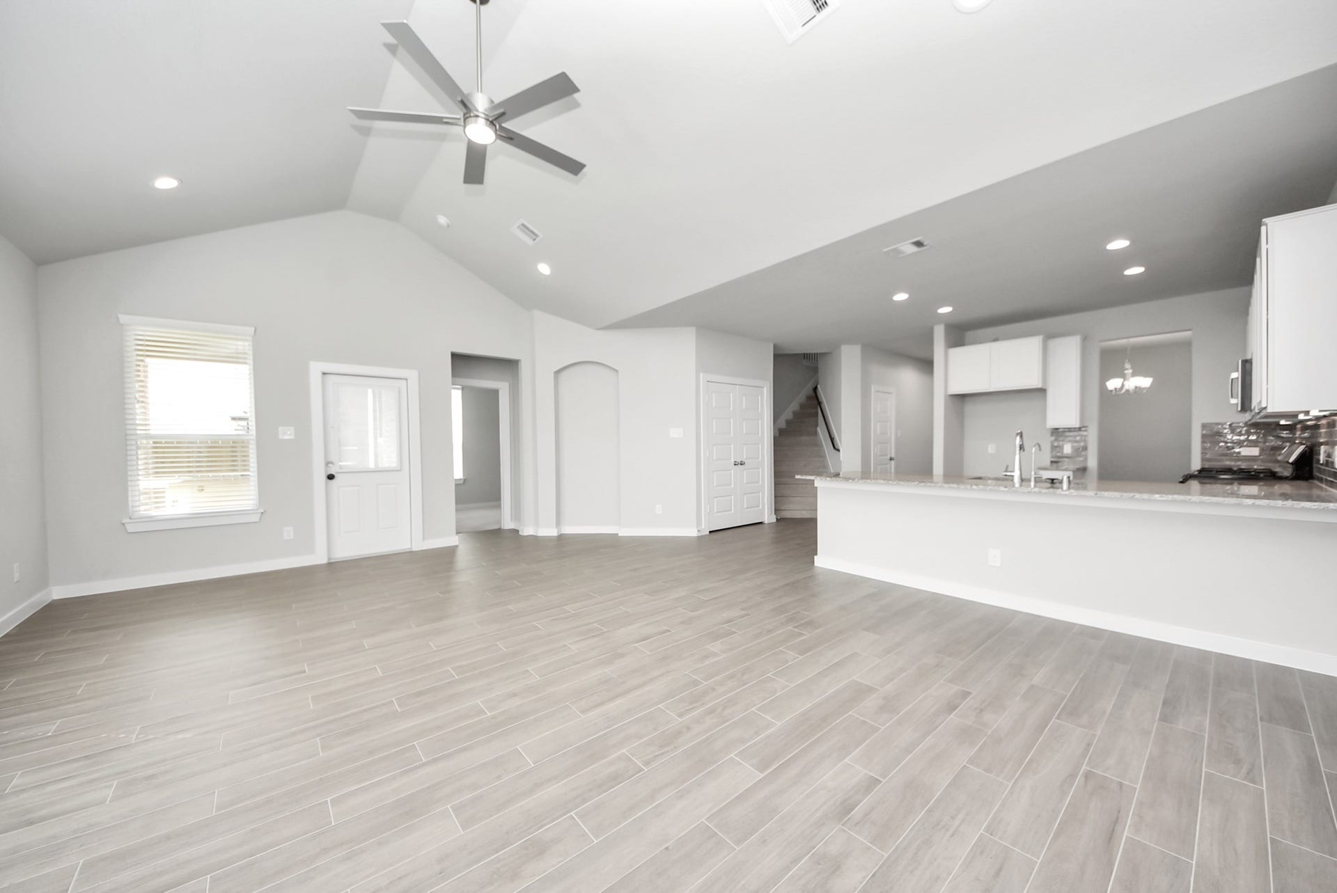 Abundant natural light flows throughout the home, highlighting the spacious living areas and creating a bright, welcoming atmosphere.